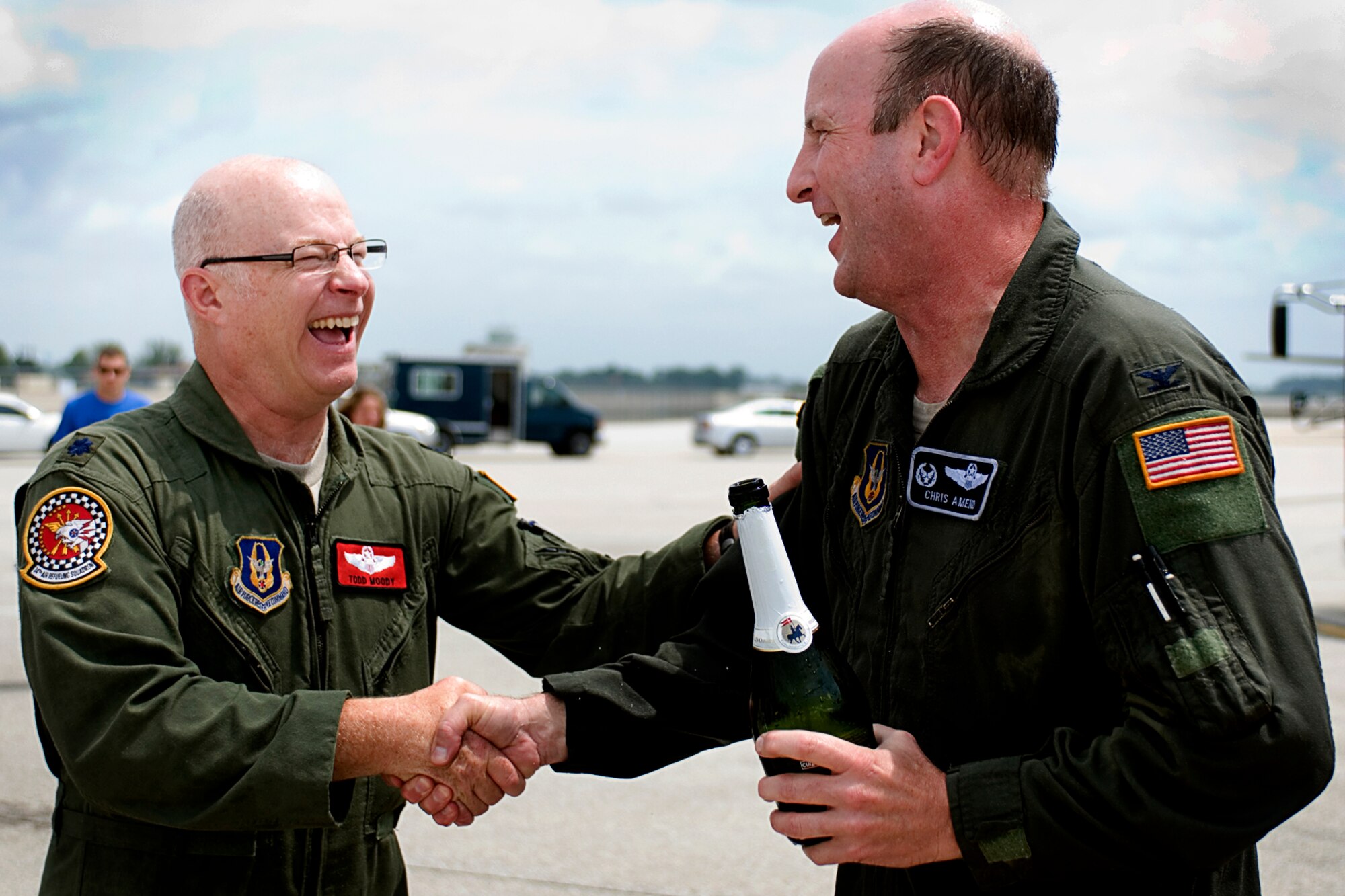 Col. Chris Amend, 434th Operation Group commander, right, is congratulated by Lt. Col. Todd Moody, 74th Air Refueling Squadron operations officer, after Amend's final flight at Grissom Air Reserve Base, Ind., Aug. 7, 2013. Amend is moving to Scott AFB, Ill., where he will serve as the reserve advisor to the commander of Air Mobility Command. (U.S. Air Force photo/Tech. Sgt. Mark R.W. Orders-Woempner)