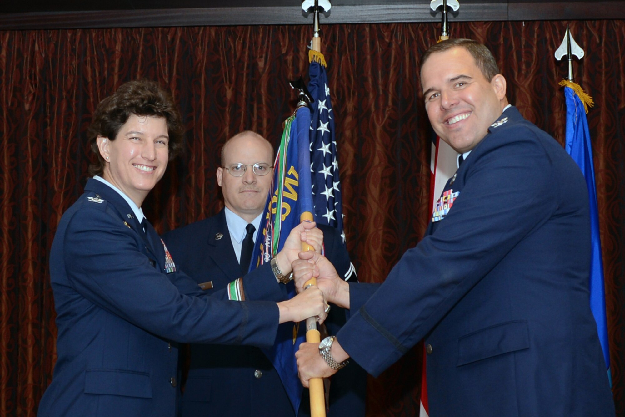 RAF MENWITH HILL, United Kingdom - Col. Joseph Ogea Sr. assumed command of the 421st Air Base Group from Col. Angela Cadwell, 501st Combat Support Wing commander, during a change of command ceremony at the RAF Menwith Hill Community Club Aug. 7. (U.S. Air Force photo by Staff Sgt. Deborah Lockhart)
