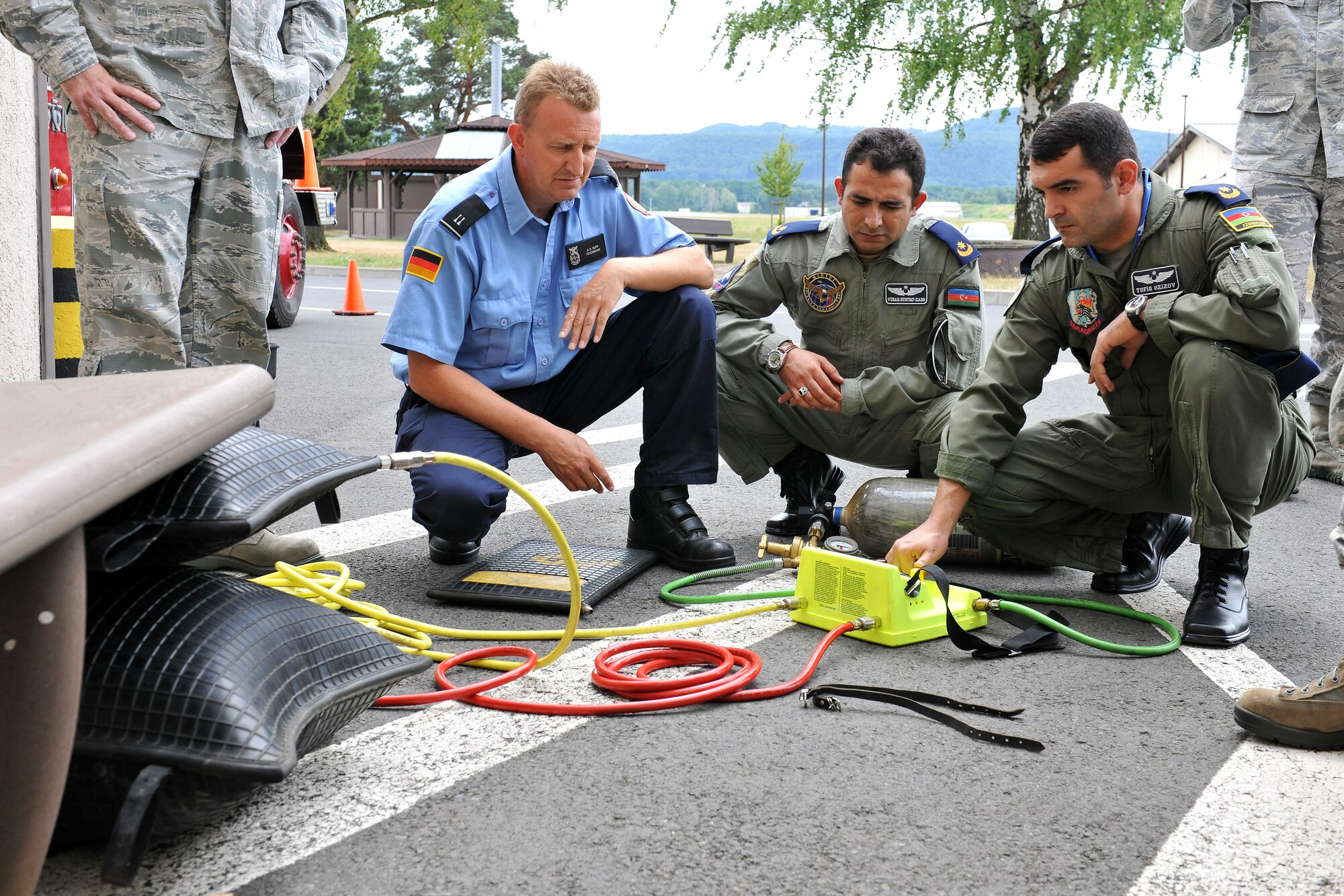 Members of the Azeri air force review the fire response capabilities the 86th Civil Engineer Squadron provides, Aug. 7, 2013, Ramstein Air Base, Germany.  The visit gave the Azeri air force a chance to further military relations and improve the partnership between the U.S. and Azeri forces.  (U.S. Air Force photo/Senior Airman Chris Willis)