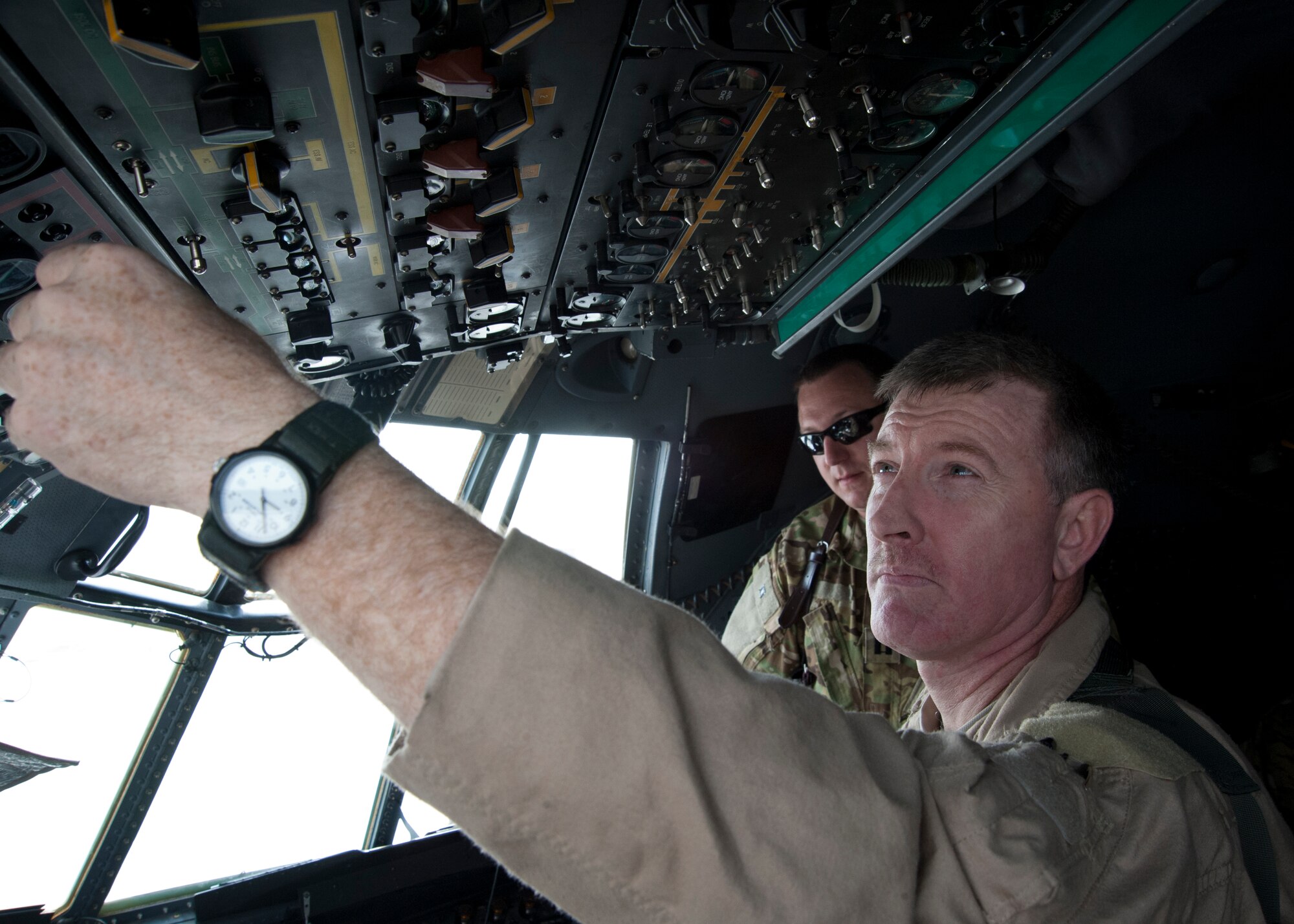 Tech. Sgt. Rob Watkins completes a cockpit checklist prior to a C-130 Hercules mission at the 379th Air Expeditionary Wing in Southwest Asia, Aug. 15, 2013. Watkins is a 746th Expeditionary Airlift Squadron C-130 flight engineer deployed from Peterson Air Force Base, Colo., and a Denver native. U.S. Air Force photo/Senior Airman Bahja J. Jones)