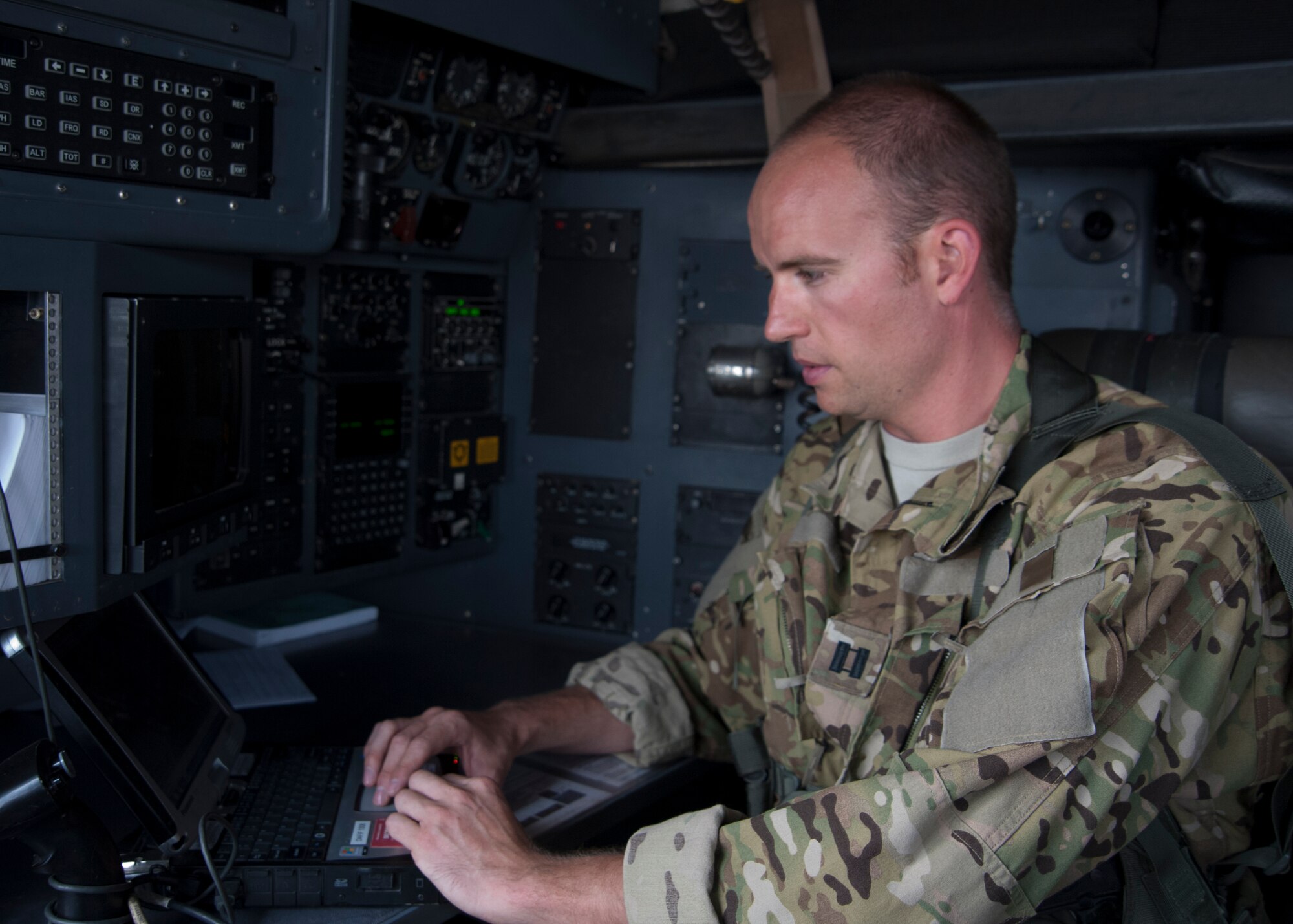 Capt. Nick Dale sets up navigation equipment prior to a C-130 Hercules mission at the 379th Air Expeditionary Wing in Southwest Asia, Aug. 15, 2013. Dale is a 746th Expeditionary Airlift Squadron C-130 navigator deployed from Peterson Air Force Base, Colo., and a Colorado Springs native. (U.S. Air Force photo/Senior Airman Bahja J. Jones) 

