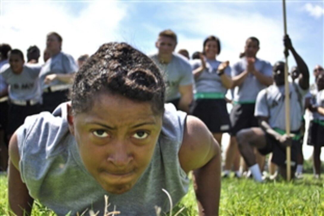 A soldier competes in a pushup contest while participating in Operation Sustainment Warrior during the Sustainer Olympics on Joint Base McGuire-Dix-Lakehurst, N.J., Aug. 15, 2013. The 77th Sustainment Brigade hosts the operation to provide training that focuses on maintaining warrior skills and enhancing individual readiness.