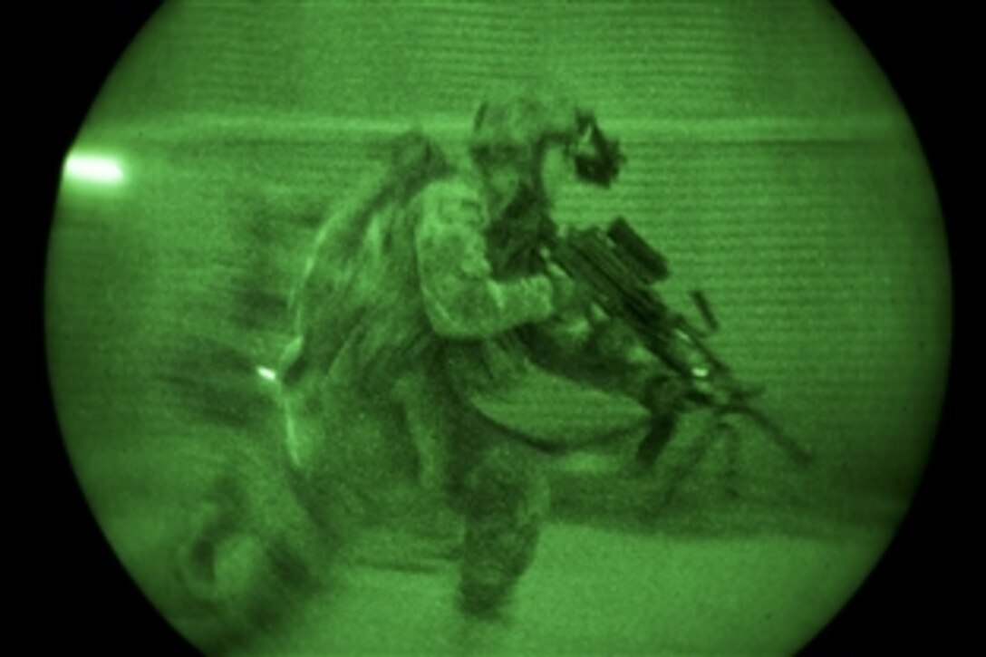 As seen through a night-vision device, U.S. Army Pfc. Jared Dinkel conducts marksmanship training on Bagram Airfield in Afghanistan's Parwan province, Aug. 11, 2013. Dinkel is assigned to the 1st Cavalry Division's Company D, 1st Battalion, 5th Cavalry Regiment, 2nd Brigade Combat Team.