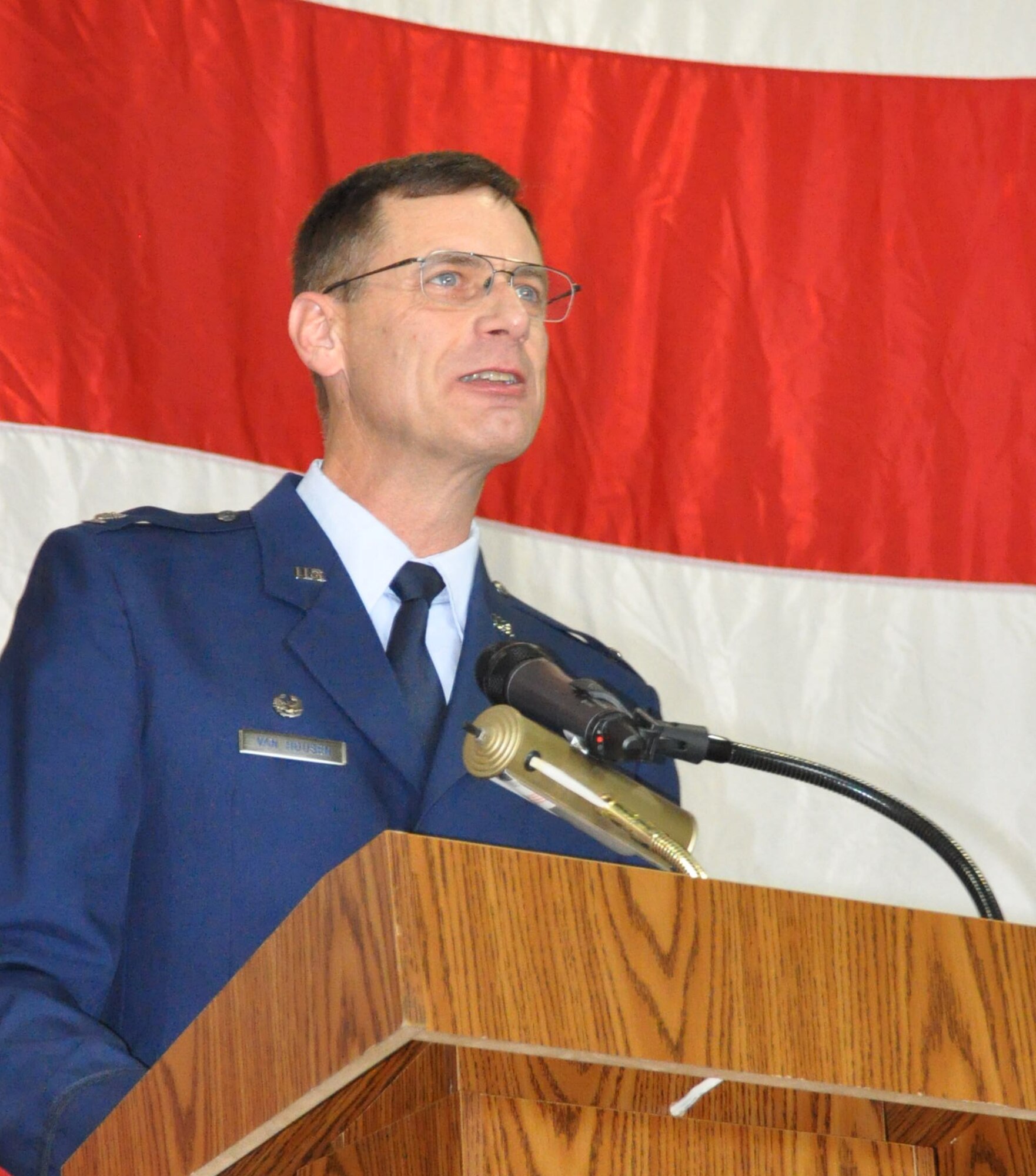 Colonel James C. Van Housen addresses the 301st Maintenance Group for the first time during his change of command ceremony Sunday, Aug. 4. During the ceremony, Brig. Gen. Ronald B. Miller, 301st Fighter Wing commander, welcomed Col. Van Housen to the wing and spoke about the new commander's experience with Total Force Integration at his former assignment as the commander of the 302nd Maintenance Group at Peterson Air Force Base, Colo. The 301st MXG was previously commanded by Col. Max Stitzer.  (U.S. Air Force photo by Senior Airman Melissa Harvey)