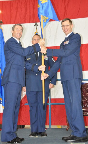 Colonel James C. Van Housen takes command of the 301st Maintenance Group during a change of command ceremony Sunday, Aug. 4. During the ceremony, Brig. Gen. Ronald B. Miller, 301st Fighter Wing commander, welcomed Col. Van Housen to the wing and spoke about the new commander's experience with Total Force Integration at his former assignment as the commander of the 302nd Maintenance Group at Peterson Air Force Base, Colo. The 301st MXG was previously commanded by Col. Max Stitzer.  (U.S. Air Force photo by Senior Airman Melissa Harvey)