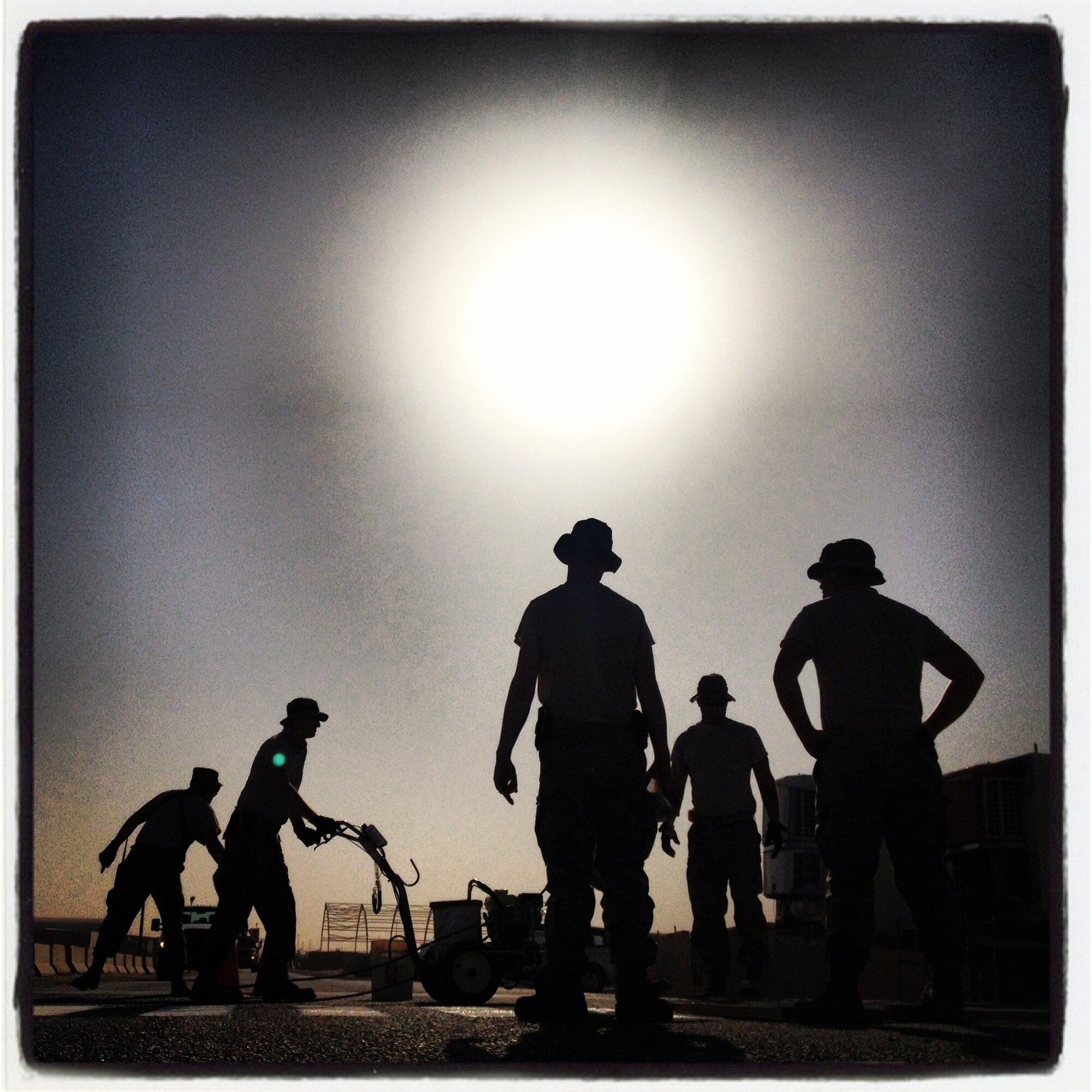 A team of Airmen from the 386th Air Expeditionary Wing’s Civil Engineer Squadron apply fresh paint to a intersection crosswalk on base Friday, August 16, 2013.  (U.S. Air Force photo by 1st Lt. Nathan Wallin) (This image was created using Instagram)