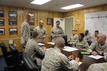 Sgt. Agustin A. Molinanavarro, a warehouse clerk with 2nd Supply Battalion, Combat Logistics Regiment 25, 2nd Marine Logistics Group introduces the acting command staff during the battalion’s weekly command and staff meeting during the unit’s non-commissioned officer, or NCO, day aboard Camp Lejuene, N.C., Aug. 14, 2013. Molinanavarro was hand-picked to serve as the battalion commander during the NCO day and carried out many of the responsibilities that came with the position.