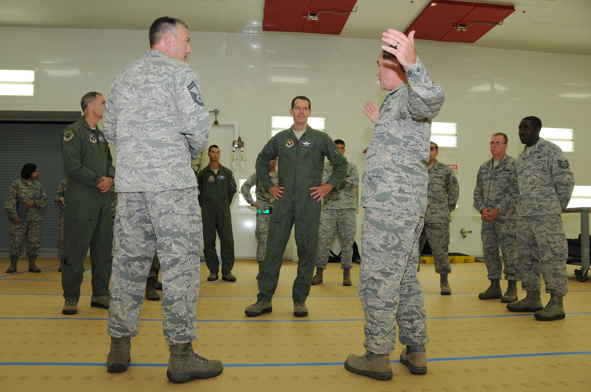 Lt. Gen. Stanley E. Clarke III (middle), director of the Air National Guard, meets Senior Master Sgt. (left), Schuyler G. Griswold, 1st Fighter Wing Maintenance Squadron and Senior Master Sgt. Gerry L. Mabry, 192d Fighter Wing Aircraft Maintenance Squadron, during a visit to the 192D FW at Joint Base Langley-Eustis, Hampton, Va., Aug. 16.  The visit is Clarke's first to the Virginia Air Guard since becoming director. During the visit, Clarke met with Airmen from the low observables section and the intelligence squadron where he listened to Airmen talk about the Total Force Integration with the 1st FW. (U.S. Air National Guard photo by Master Sgt. Carlos Claudio/Released).