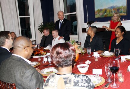 Vice President Joe Biden and his wife, Dr. Jill Biden, enjoy spending time with service members and their families during a Thanksgiving dinner for wounded warriors in their home at the U.S. Naval Observatory in Washington, D.C., Nov. 21, 2011.