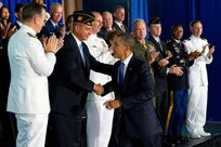 President Barack Obama greets guests, including military veterans, after a speech at the Washington Navy Yard, Aug. 5, 2011. Obama discussed a series of administration initiatives to help America's veterans find employment.