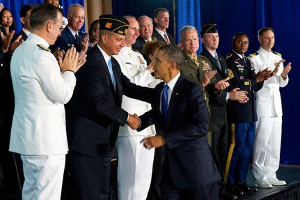 President Barack Obama greets guests, including military veterans, after a speech at the Washington Navy Yard, Aug. 5, 2011. Obama discussed a series of administration initiatives to help America's veterans find employment.