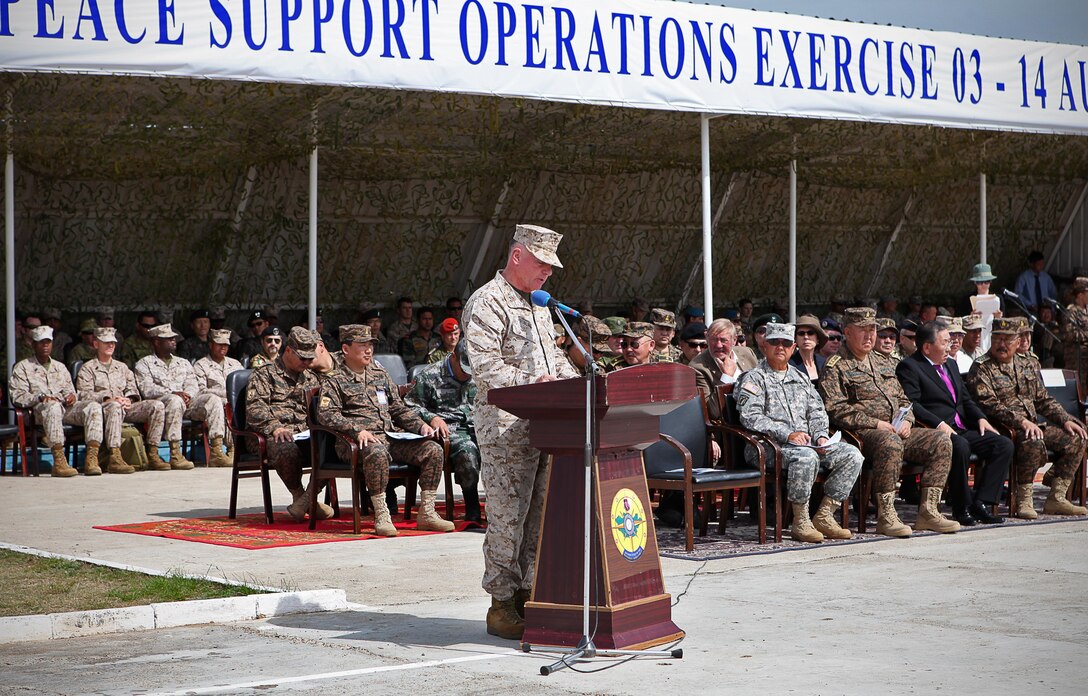 Lt. Gen. Terry G. Robling, commander of U.S. Marine Corps Forces Pacific, addresses service members from 13 nations during the closing ceremony for exercise Khaan Quest 2014, Aug. 14. The multinational peacekeeping exercise is hosted annually by the Mongolian Armed Forces and co-sponsored by U.S. Marine Corps Forces Pacific and U.S. Army Pacific, and designed to promote regional peace and security. The intent of Khaan Quest 2013 was to enhance military-to-military interoperability in peacekeeping operations and increase multinational cooperation. In addition to Mongolia and the United States, military personnel from Australia, Canada, France, Germany, Japan, India, Nepal, South Korea, Tajikistan, United Kingdom and Vietnam also participated in the exercise. MARFORPAC served as the U.S. executive agent for this year’s exercise.