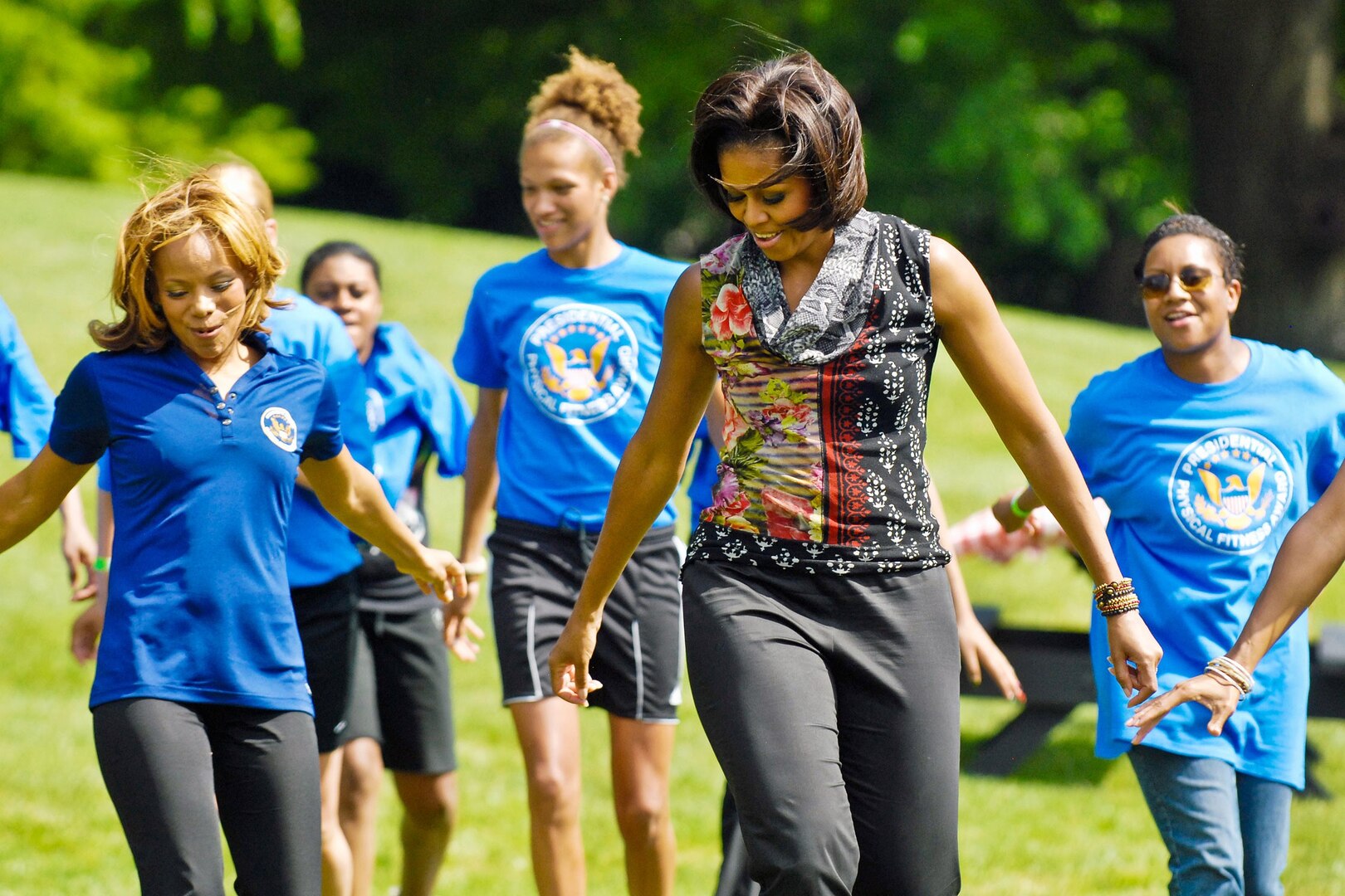 First Lady Michelle Obama shows off her dance moves for National Guard and Reserve teens at a fitness and nutrition event on the White House's South Lawn, May 9, 2011. During the event, the first lady announced a new fitness industry effort to support military families, particularly Guard and Reserve families.