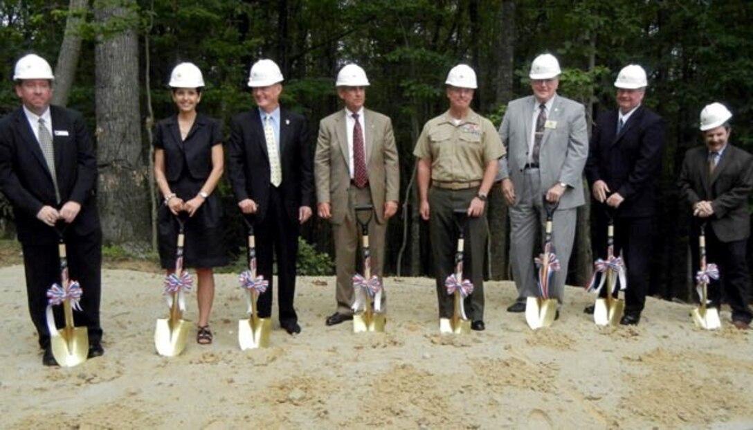 Will Karbach, president and CEO of Branch Highways; Sandy Day, wife of Timothy T. Day; Timothy T. Day, sponsor of the Timothy T. Day Overlook;  Lt. Gen. Robert Blackman, retired Marine and president and CEO of the Marine Corps Heritage Foundation; Col. David Maxwell, Marine Corps Base Quantico commander; John Jenkins, representing the Prince William County board of supervisors; Garrett Moore, VDOT chief engineer and Miles Freidman, chairman of the Quantico Belvoir Regional Business Alliance; dig shovels in the dirt at the “Heritage Parkway and Timothy T. Day Overlook” groundbreaking ceremony Aug. 13, 2013 at Semper Fidelis Memorial Park.             