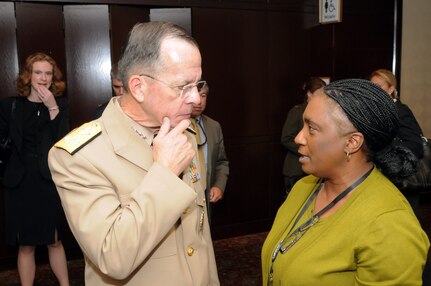 Adm. Mike Mullen, the chairman of the Joint Chiefs of Staff, talks with Elaine Wright, who volunteers with the Maryland National Guard's family programs, at the 2010 National Guard Family Program Volunteer Workshop in New Orleans, La., on Aug. 2, 2010.