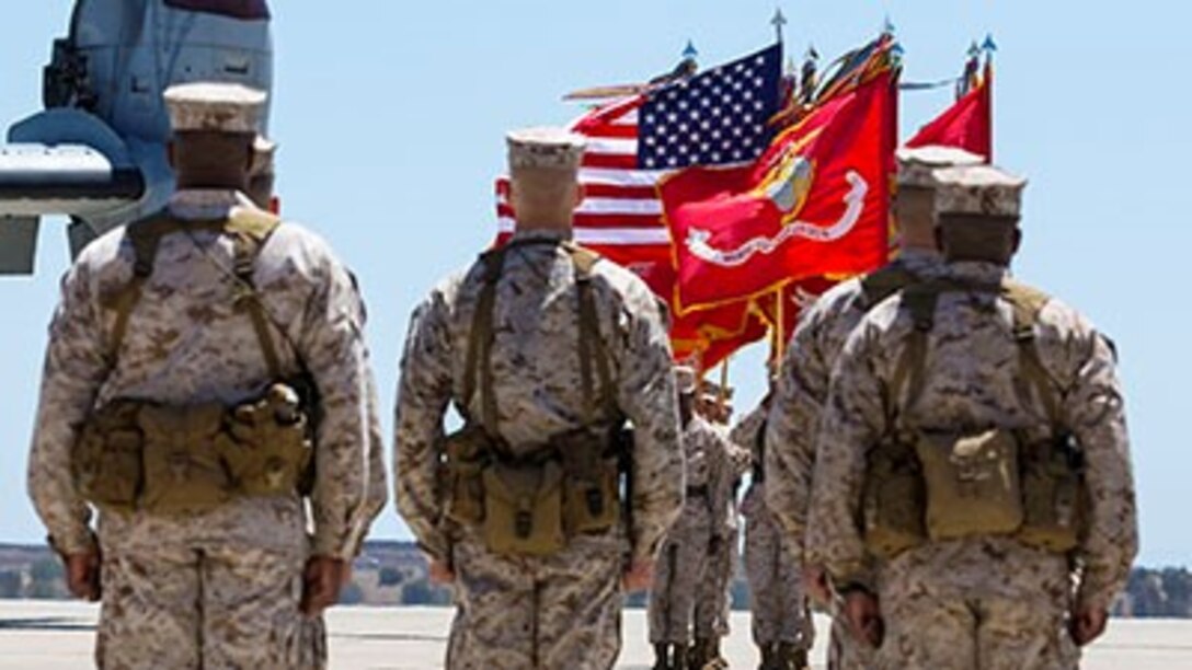 Marines stand in formation during a Marine Aircraft Group 16 change of command ceremony aboard Marine Corps Air Station Miramar, Calif., Aug. 8. Col. Patrick Gramuglia, relinquished his duties to Col. Anthony Bianca, who came from the previous command of Marine Medium Tiltrotor Squadron 261 .