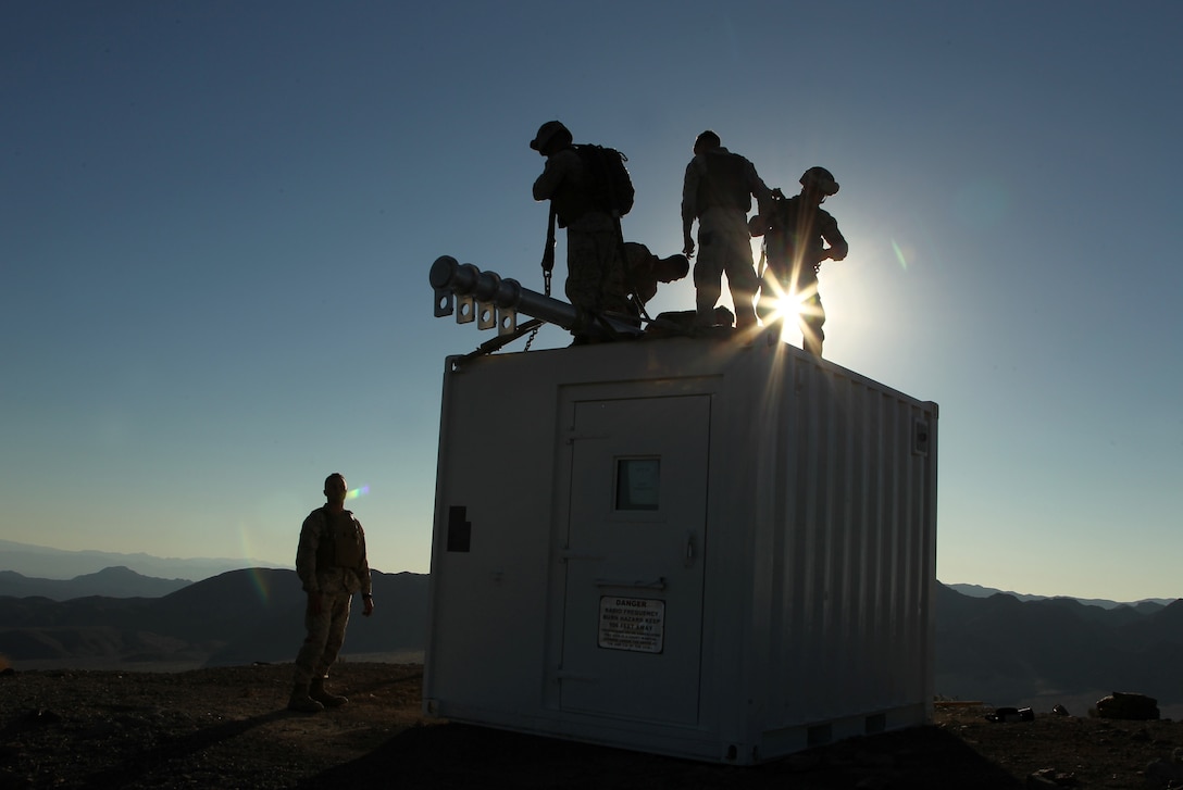 Marines with Combat Logistics Battalion 7 prepare a container for helicopter extraction at Observation Post Crampton in the Combat Center's training area. Marines with Combat Logistics Battalion 7 and HMH-366 extracted communication gear. The units used the extraction as a training exercise.