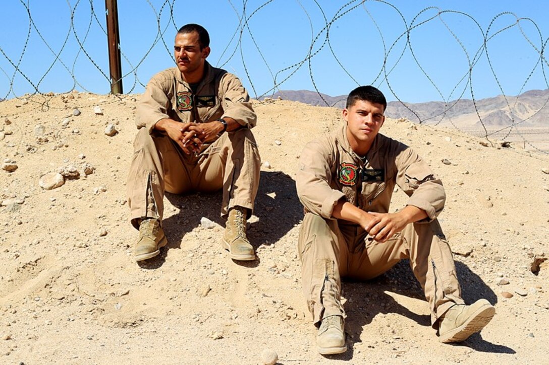 Lance Cpl. Patrick Becker and Sgt. Michael Losey, both crew chiefs with Marine Light Attack Helicopter Squadron 367, met at Naval Air Station, Pensacola, Fla., and later became brother-in-laws when Becker met Losey’s sister. 