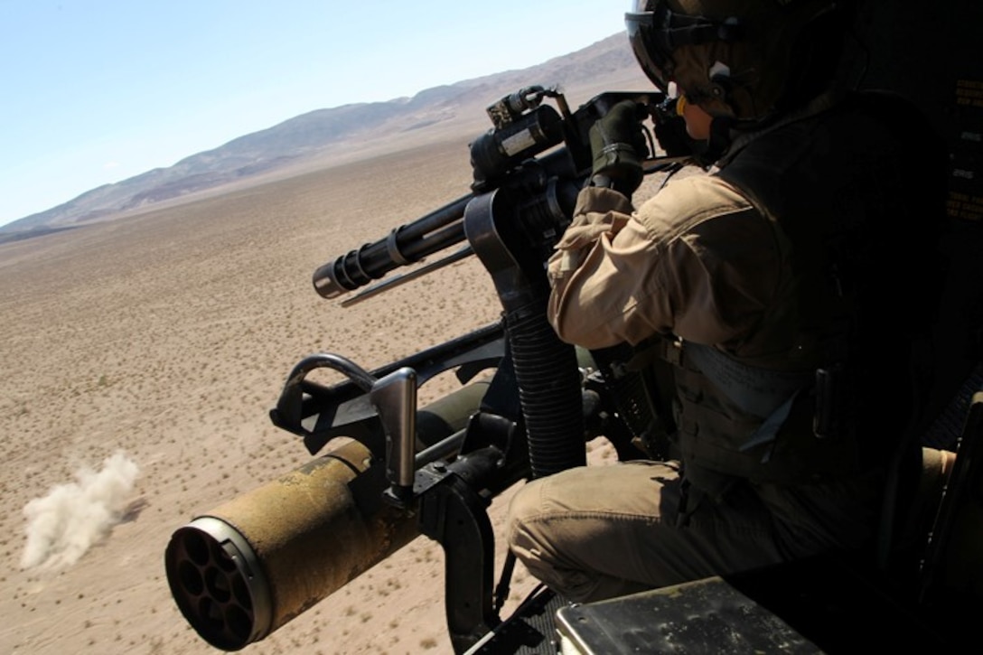 gt. Michael V. Losey, crewman, Marine Light Attack Helicpoter Squadron 367, fires a M240 G machine gun during a Tactical Recovery of Aircraft and Personnel mission at the Combat Center’s Lavic Lake Training Area July 30, 2013. 
