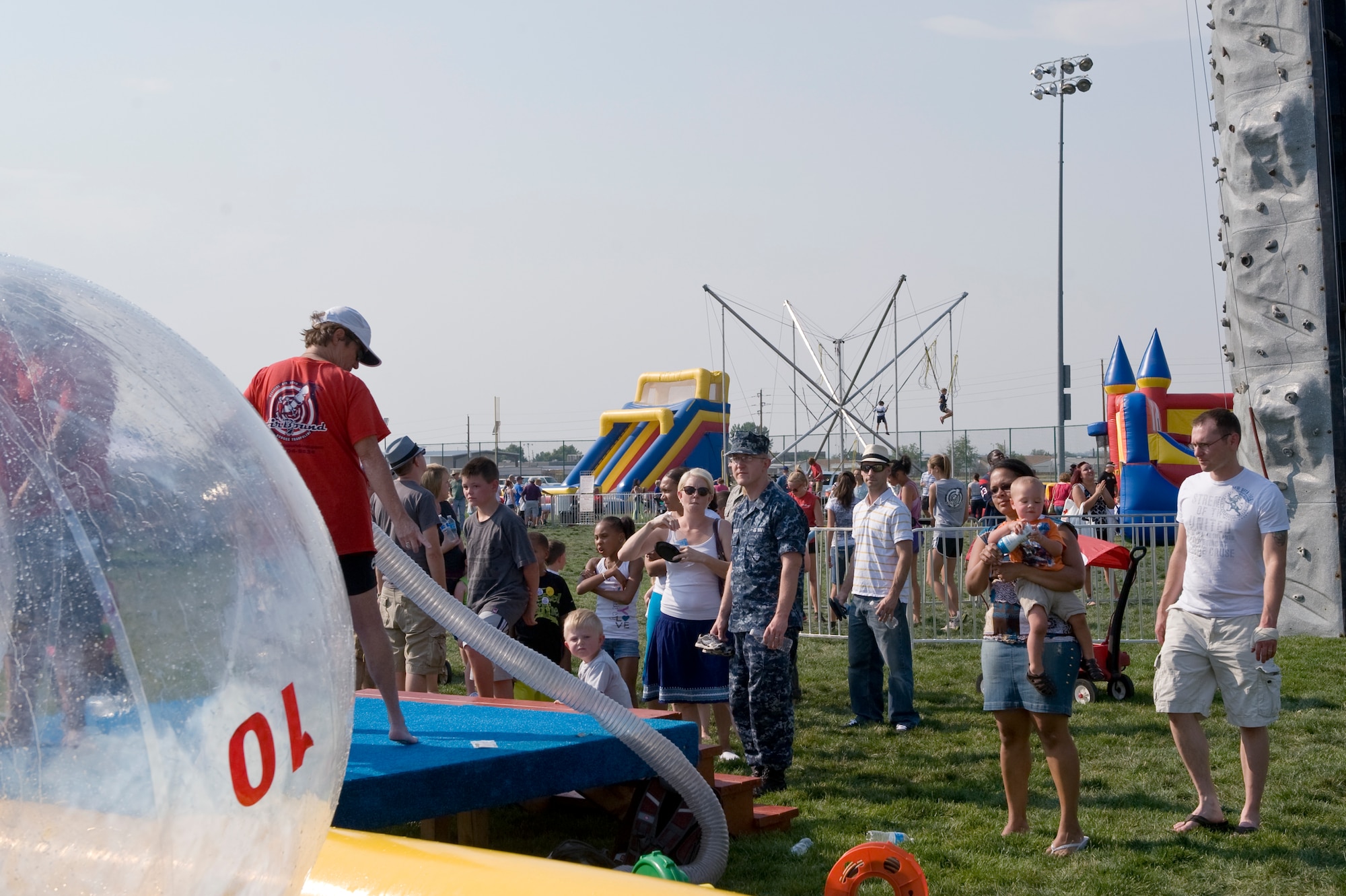 Members of Team Buckley participate in various events during Fun Fest Aug. 13, 2013, at the softball fields on Buckley Air Force Base, Colo. Fun Fest is an annual Buckley birthday celebration which includes a day full of field-day activities and a community fair. (U.S. Air Force photo by Senior Airman Phillip Houk/Released)