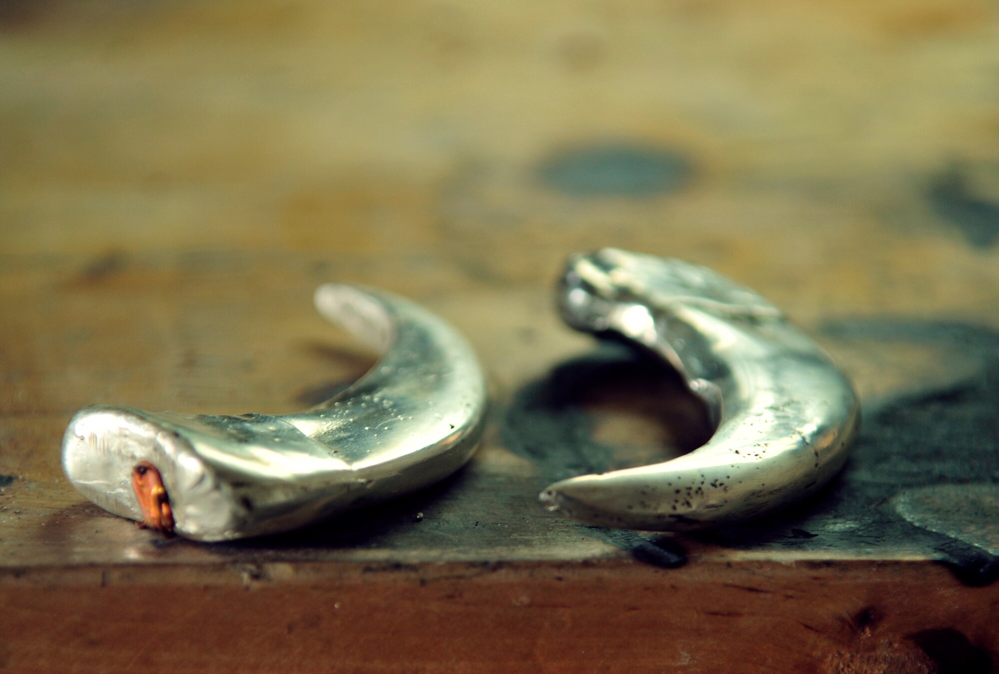 This pair of claws containing the ashes of a child was cast from silver by Staff Sgt. James Ebbs, 6th Communications Squadron network infrastructure supervisor. The parents of the child found Ebbs on a silver enthusiast online forum and asked him to make small urns for the ashes. (U.S. Air Force photo by Airman 1st Class Sarah Breer/released/cropped for point of interest)