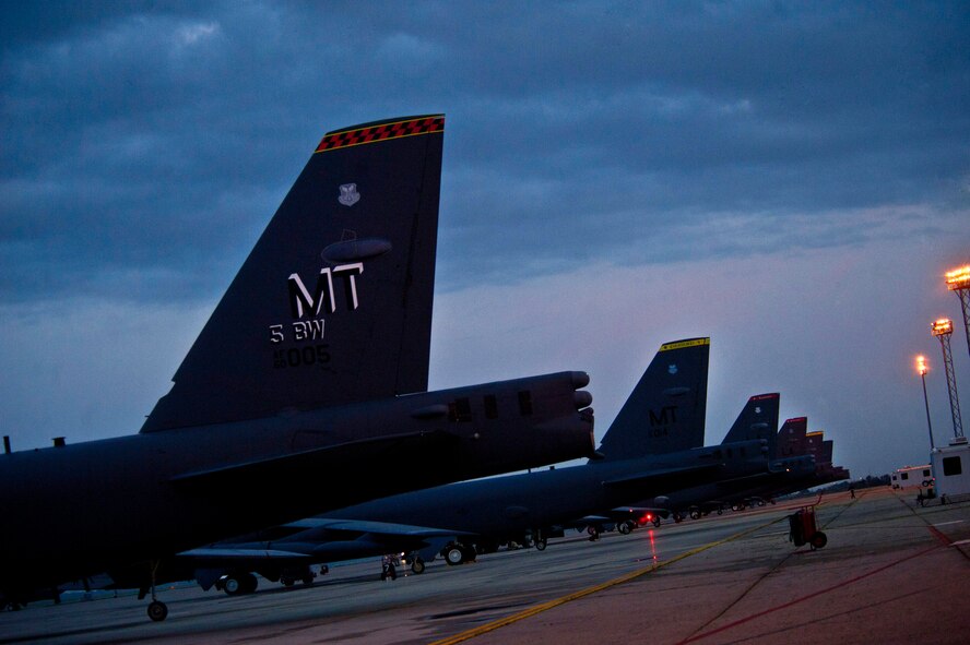 Several B-52H Stratofortresses prepare to be launched during a minimum-interval takeoff at Minot Air Force Base, N.D., Aug. 15, 2013. This procedure allows alert teams to respond as rapidly as possible when called upon.  (U.S. Air Force photo/Senior Airman Brittany Y. Auld)