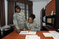 Master Sgt. Terri Harmon and Master Sgt. Sanelle Romero, former and current Joint Base San Antonio-Randolph career assistance advisors, respectively, discuss roles and responsibilities of the position Aug. 2.  ( U. S. Air Force photo by Don Lindsey)