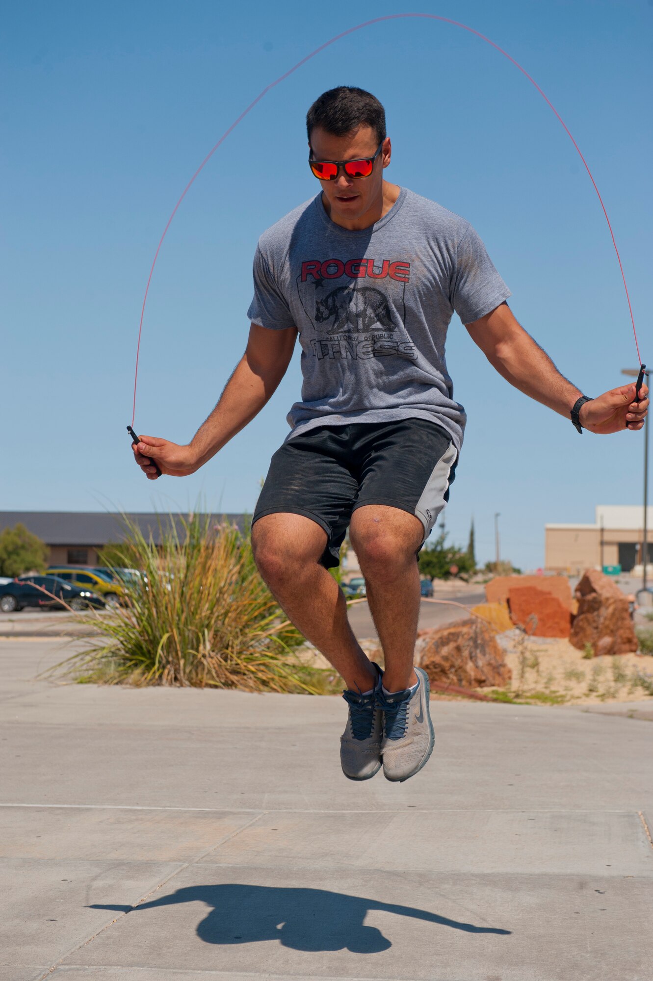 An Airman jumps rope as a part of the “Fittest Wingman Challenge” at Holloman Air Force Base, N.M., Aug. 16. The Fittest Wingman Challenge was part of Comprehensive Airman Fitness Day which encouraged a total fitness approach to well-being. This quarters CAF day was focused on physical fitness, members of Team Holloman participated in a wing run, followed by various sporting events.  Participants learned the importance of physical activity and comradery. (U.S. Air Force photo by Airman 1st Class Daniel E. Liddicoet/Released)
