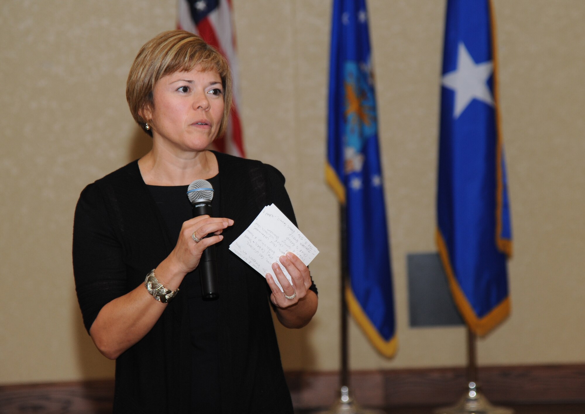 Chief Master Sgt. Angie Johnson, 81st Training Wing command chief, delivers final remarks during the Johnson’s farewell dinner Aug. 15, 2013, at the Bay Breeze Event Center, Keesler Air Force Base, Miss. Johnson leaves Keesler to become the command chief for Air Force Space Command’s Space and Missile Systems Center, Los Angeles Air Force Base, Calif.  (U.S. Air Force photo by Kemberly Groue)