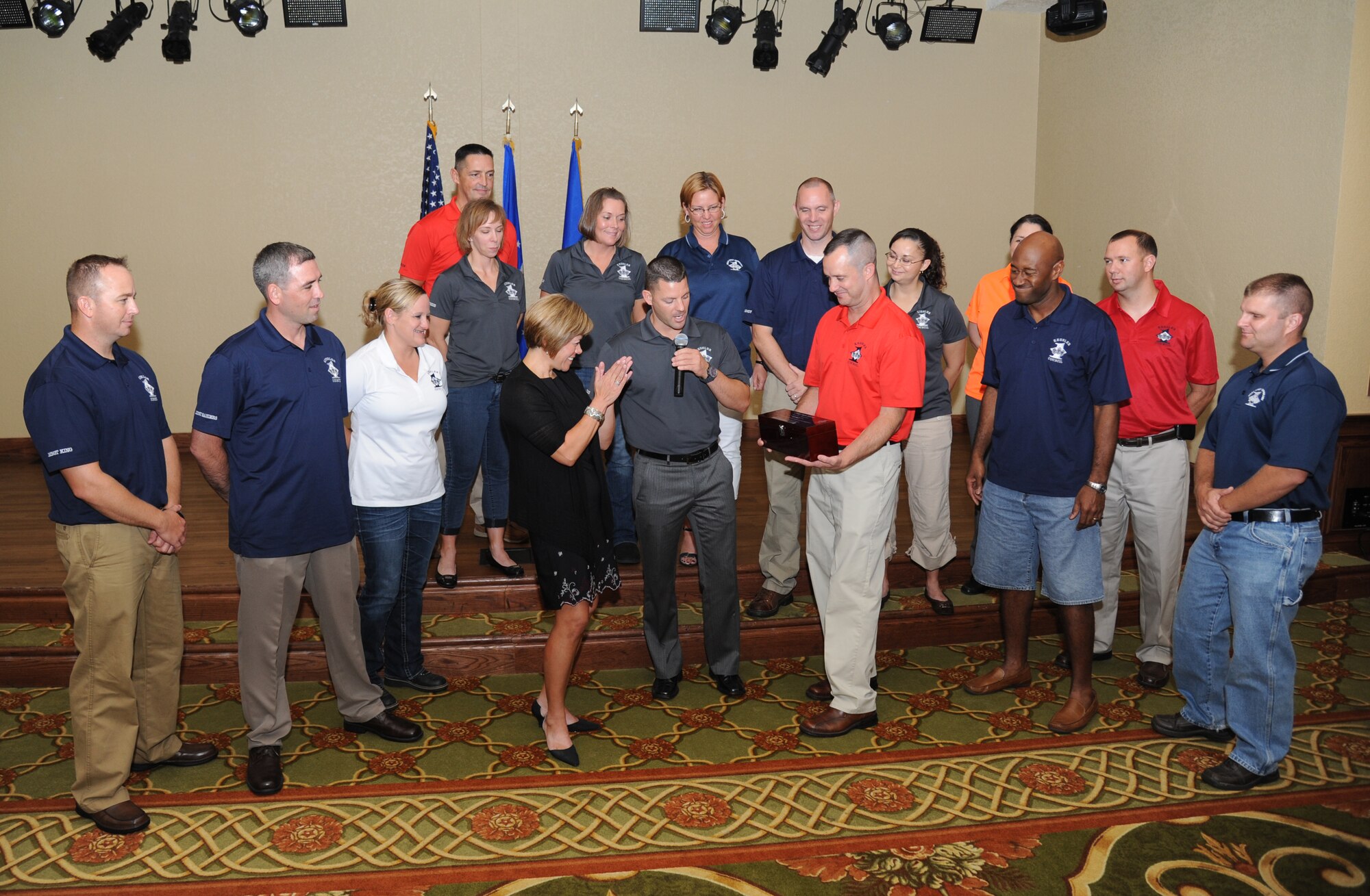 The First Sergeant’s Council presents a going-away gift to Chief Master Sgt. Angie Johnson, 81st Training Wing command chief, during the Johnson’s farewell dinner Aug. 15, 2013, at the Bay Breeze Event Center, Keesler Air Force Base, Miss. Johnson leaves Keesler to become the command chief for Air Force Space Command’s Space and Missile Systems Center, Los Angeles Air Force Base, Calif.  (U.S. Air Force photo by Kemberly Groue)