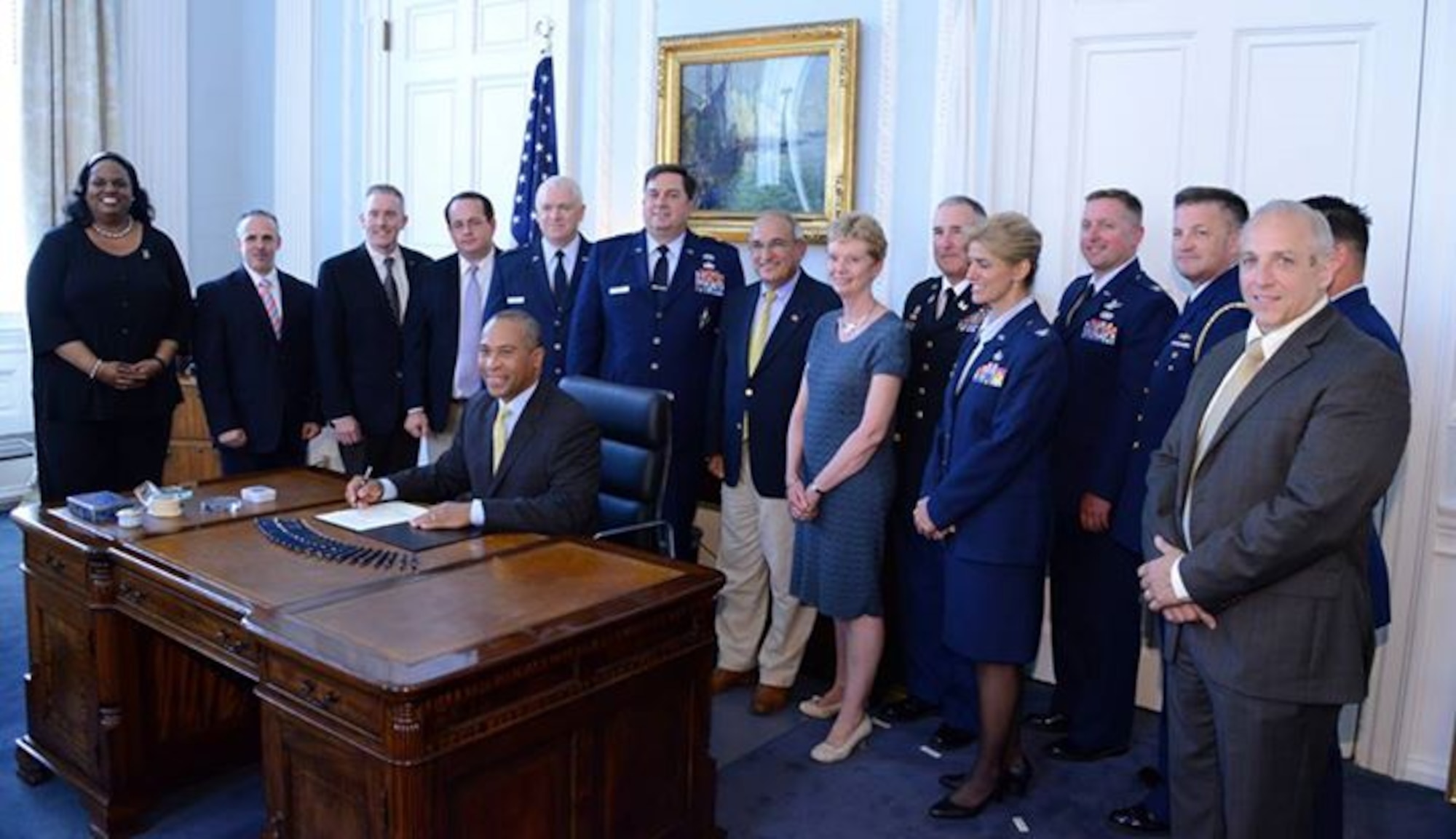 BOSTON – Gov. Patrick signs Executive Order No. 547 on Friday, July, 17, 2013, at the State House. Pictured from left to right behind Gov. Patrick are: Sec. Matthew Malone, Secretary of Education, State Sen. Michael Rush (D-Roxbury), State Rep. Brian Mannal (D-Barnstable), Maj. Gen. L. Scott Rice, The Adjutant General of Massachusetts, Brig. Gen. Gary W. Keefe, Assistant Adjutant General (Air) of the Massachusetts National Guard and Executive Director of Joint Base Cape Cod. (U.S. Army National Guard photo by Master Sgt. Don Veitch/Released).
