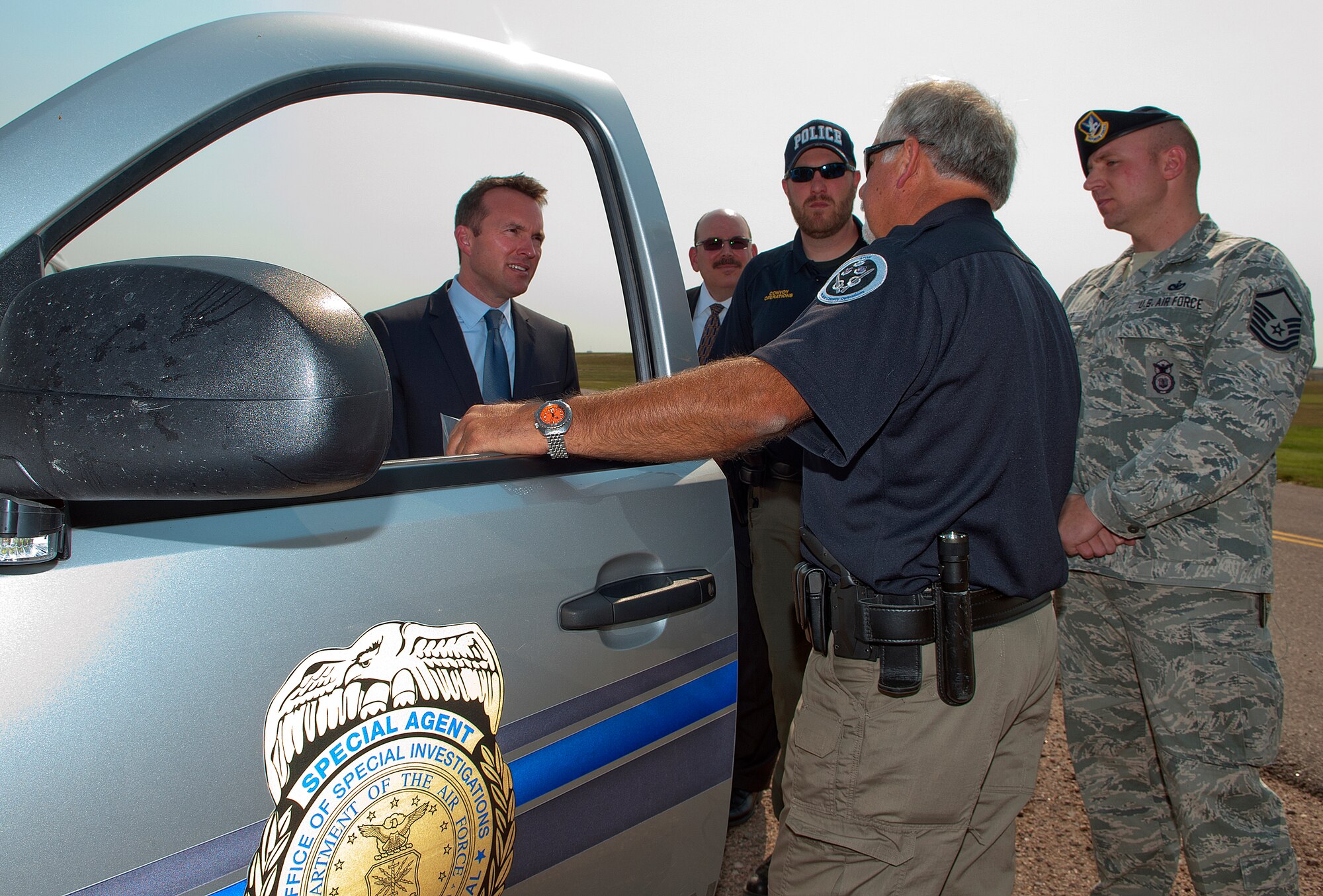 Acting Secretary of the Air Force Eric Fanning is briefed on nuclear convoy procedures by Special Agent Steve Collins, Air Force Office of Special Investigations, during a visit to F.E. Warren Air Force Base, Wyo., Aug. 16, 2013. Special Agent Jason Cooper, Master Sgt. Ryan Miller, 790th Missile Security Forces Squadron, and Scott Couture, Fanning’s special assistant for the nuclear program, also took part in the briefing. The 90th Missile Wing operates launch facilities in Wyoming, Nebraska and Colorado using convoys to transport assets. (U.S. Air Force photo by R.J. Oriez)