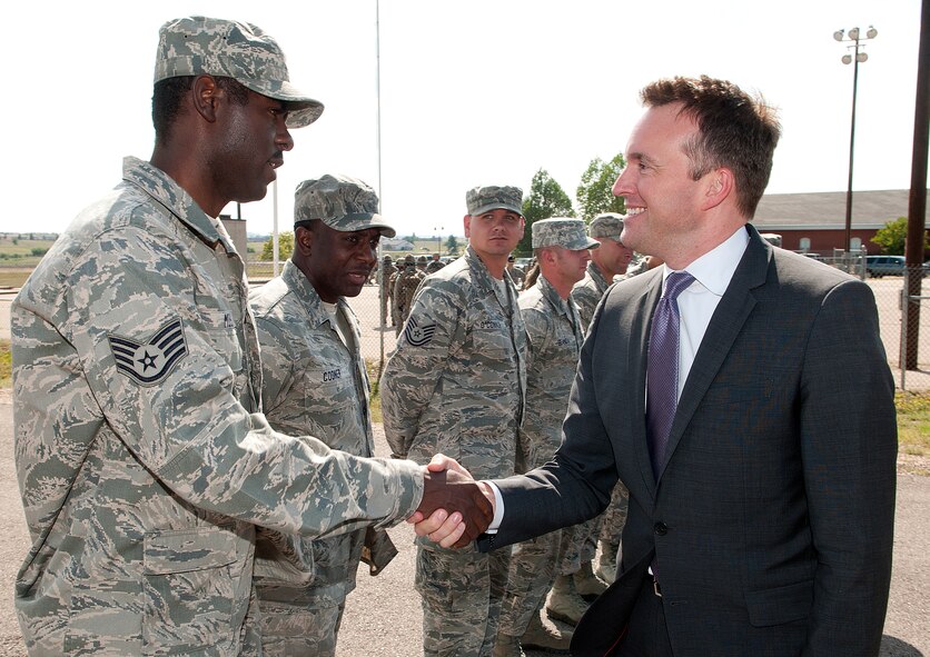 Acting Secretary of the Air Force Eric Fanning shakes hands with Staff Sgt. Joel Moses, 90th Maintenance Operations Squadron Missile Maintenance Team instructor, during a tour of the 90th Missile Wing training launch facility on F.E. Warren Air Force Base, Wyo., Aug. 15, 2013. (U.S. Air Force photo by R.J. Oriez)