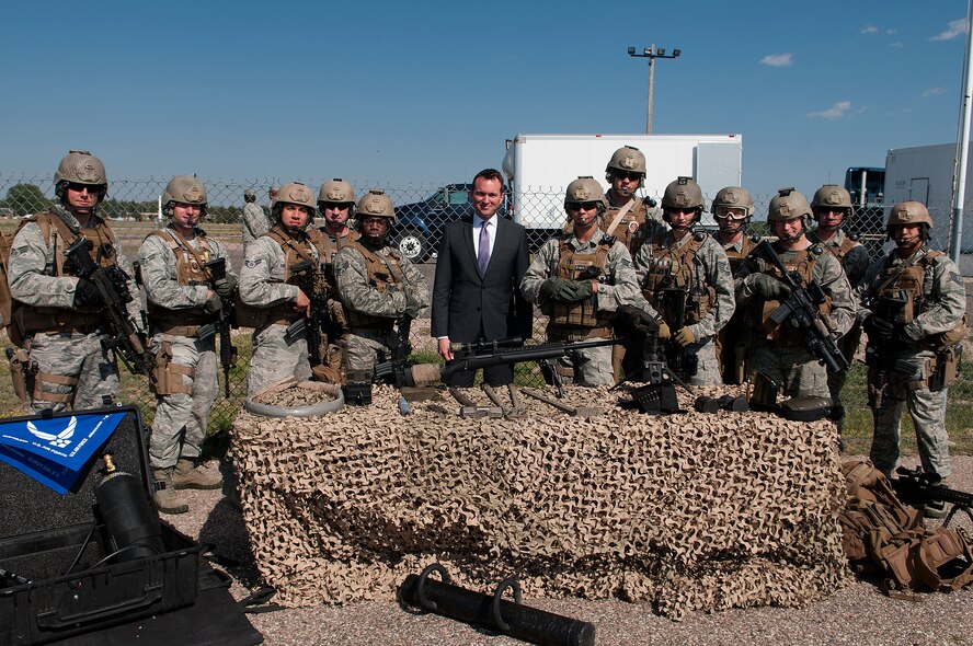 Acting Secretary of the Air Force Eric Fanning, poses with members of the 90th Security Group Tactical Response Force during a visit to F.E. Warren Air Force Base, Wyo., Aug. 15, 2013. The TRF’s mission is to protect, or if need be, recapture the 90th Missile Wings nuclear assets. (U.S. Air Force photo by R.J. Oriez)
