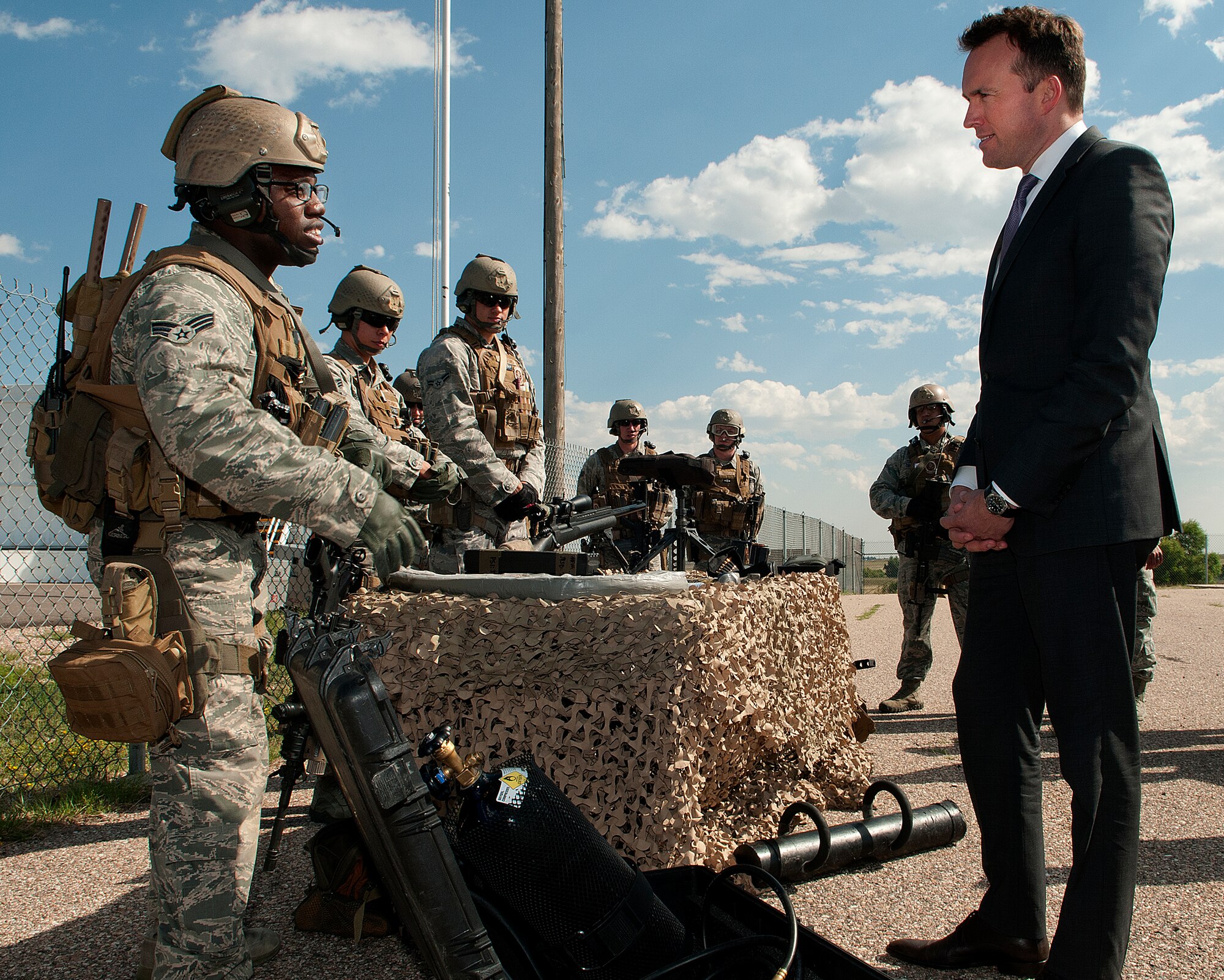 Acting Secretary of the Air Force Eric Fanning, listens to a briefing by Senior Airman Anthony Black, 90th Security Group Tactical Response Force breacher, during a visit to F.E. Warren Air Force Base, Wyo., Aug. 15, 2013. Black talked to Fanning about explosive and mechanical means of forcing entry into spaces while other members of his team briefed the secretary on weapons and tactics. The TRF’s mission is to protect, or if need be, recapture the 90th Missile Wings nuclear assets. (U.S. Air Force photo by R.J. Oriez)