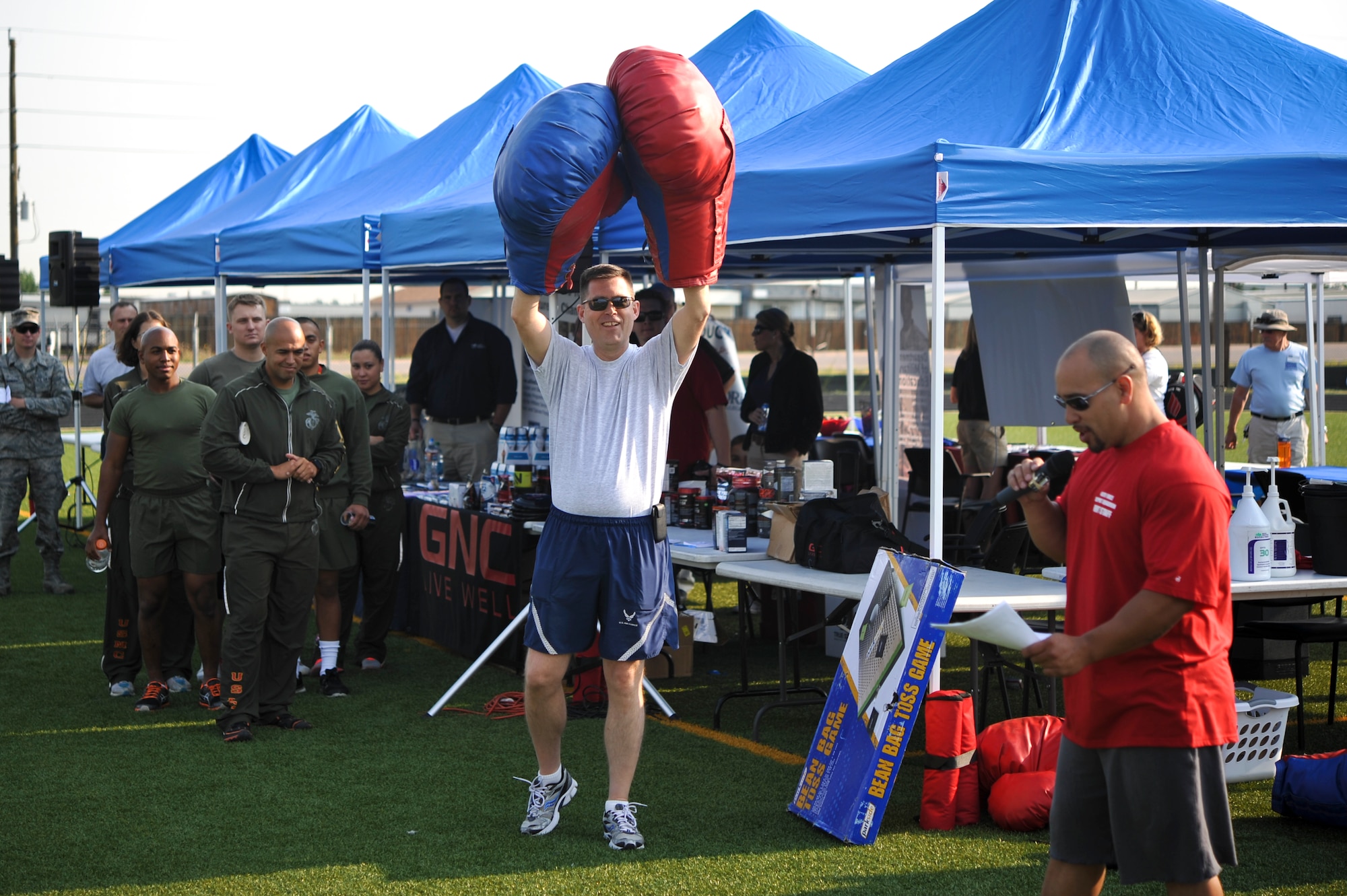 Col. Dan Wright, 460th Space Wing commander, commences the ninth annual Buckley Sports and Field Day after giving a safety brief Aug. 16, 2013, at the multi-purpose field on Buckley Air Force Base, Colo. The 460th SW celebrated its ninth birthday with Fun Fest, a day filled with sport competitions and a community fair. (U.S. Air Force photo by Airman 1st Class Riley Johnson/Released)