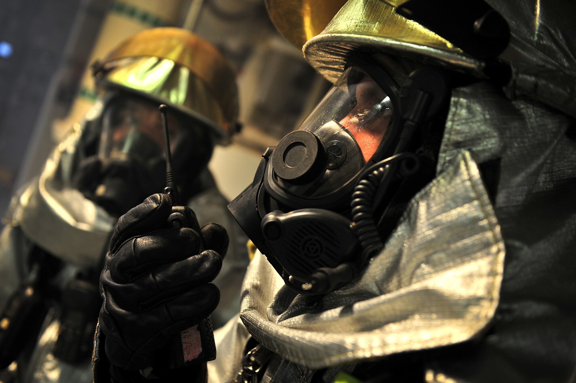 U.S. Air Force Airman from the 27th Special Operations Civil Engineer Squadron firefighters respond to a simulated incident during an exercise Aug. 16, 2013 at Cannon Air Force Base, N.M. The exercise gave the Cannon Fire Department, emergency medical personnel and Security Forces personnel a chance to fine-tune their skills in emergency response to an on base occurrence.  (U.S. Air Force photo/Tech. Sgt. Josef Cole)