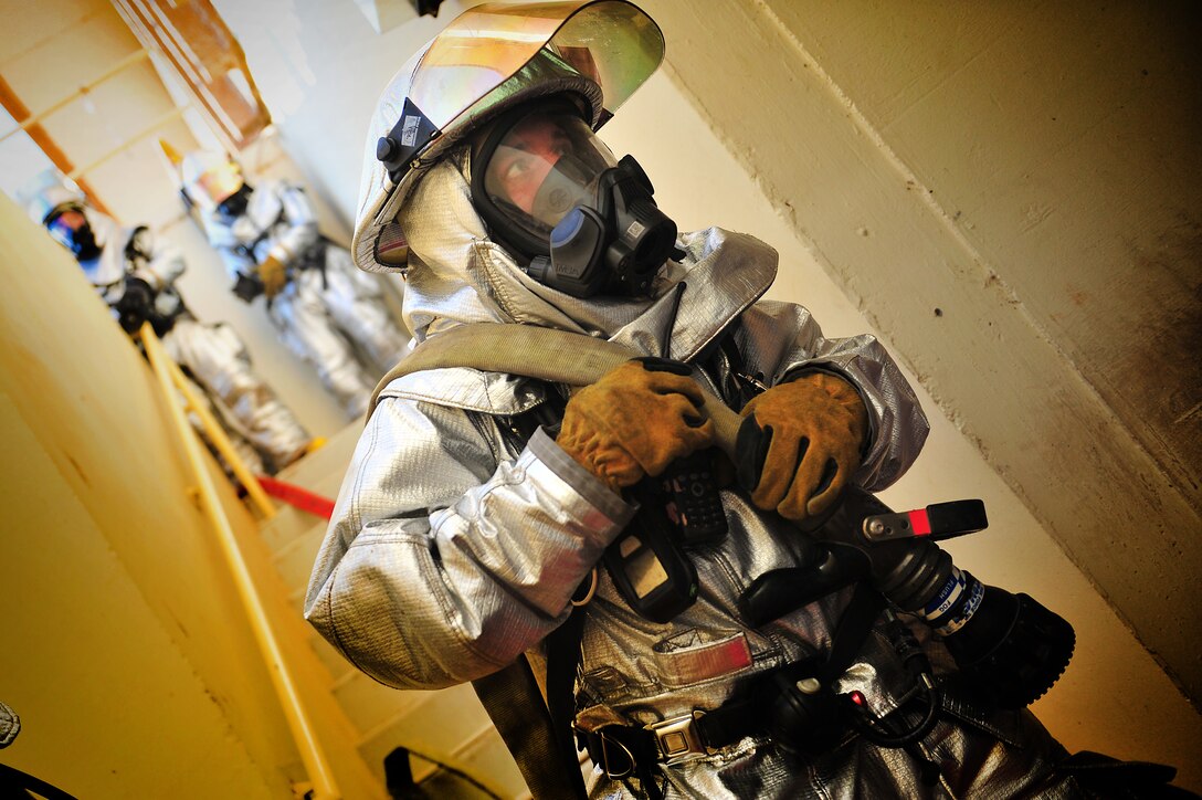 U.S. Air Force Airman from the 27th Special Operations Civil Engineer Squadron firefighters respond to a simulated incident during an exercise Aug. 16, 2013 at Cannon Air Force Base, N.M. The exercise gave the Cannon Fire Department, emergency medical personnel and Security Forces personnel a chance to fine-tune their skills in emergency response to an on base occurrence.  (U.S. Air Force photo/Tech. Sgt. Josef Cole)