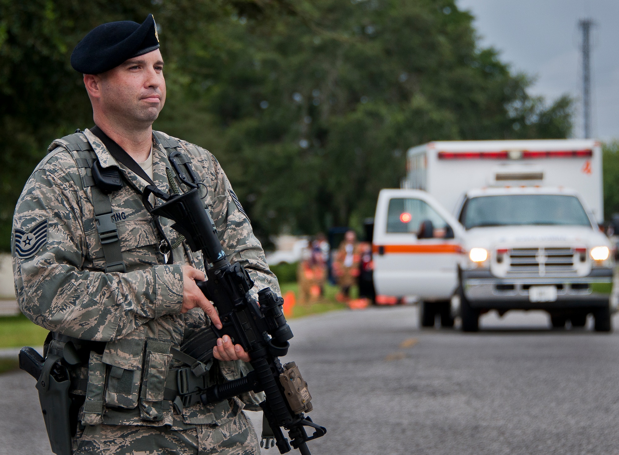 Tech. Sgt. Gary King, of the 96th Security Forces Squadron, stands guard around the perimeter of the scene of a simulated explosion during a radiological and force protection condition exercise Aug. 16 at Eglin Air Force Base, Fla.  First responders from security forces, the fire department and medical group arrived to secure the scene and help the simulated victims.  (U.S. Air Force photo/Samuel King Jr.)