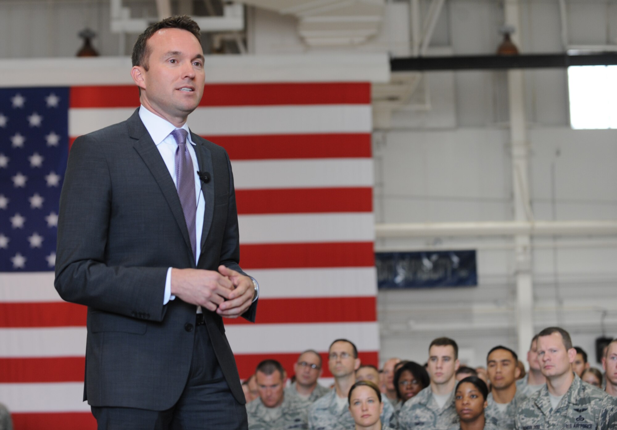 Acting Secretary of the Air Force Eric Fanning speaks to more than 300 Airmen during his visit to Whiteman Air Force Base, Mo., Aug. 15, 2013. Fanning toured a B-2 Spirit, and experienced the B-2 and A-10 Thunderbolt simulators during his visit. (U.S. Air Force photo by Staff Sgt. Alexandra M. Boutte/Released)