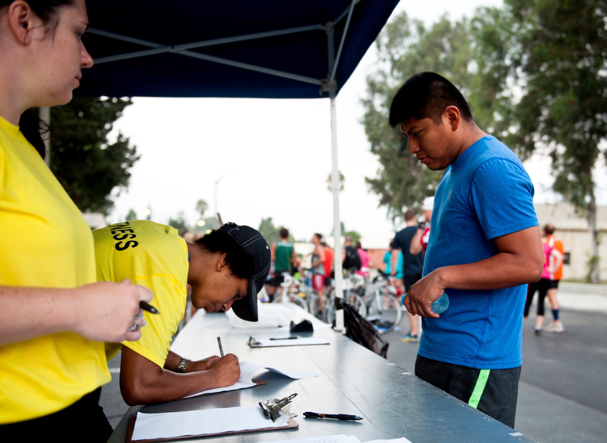 An Incirlik sprint triathlon participant registers for the race Aug. 17, 2013, at Incirlik Air Base, Turkey. The triathlon was held to encourage a fitness lifestyle and increase base morale. (U.S. Air Force photo by Senior Airman Daniel Phelps/Released)