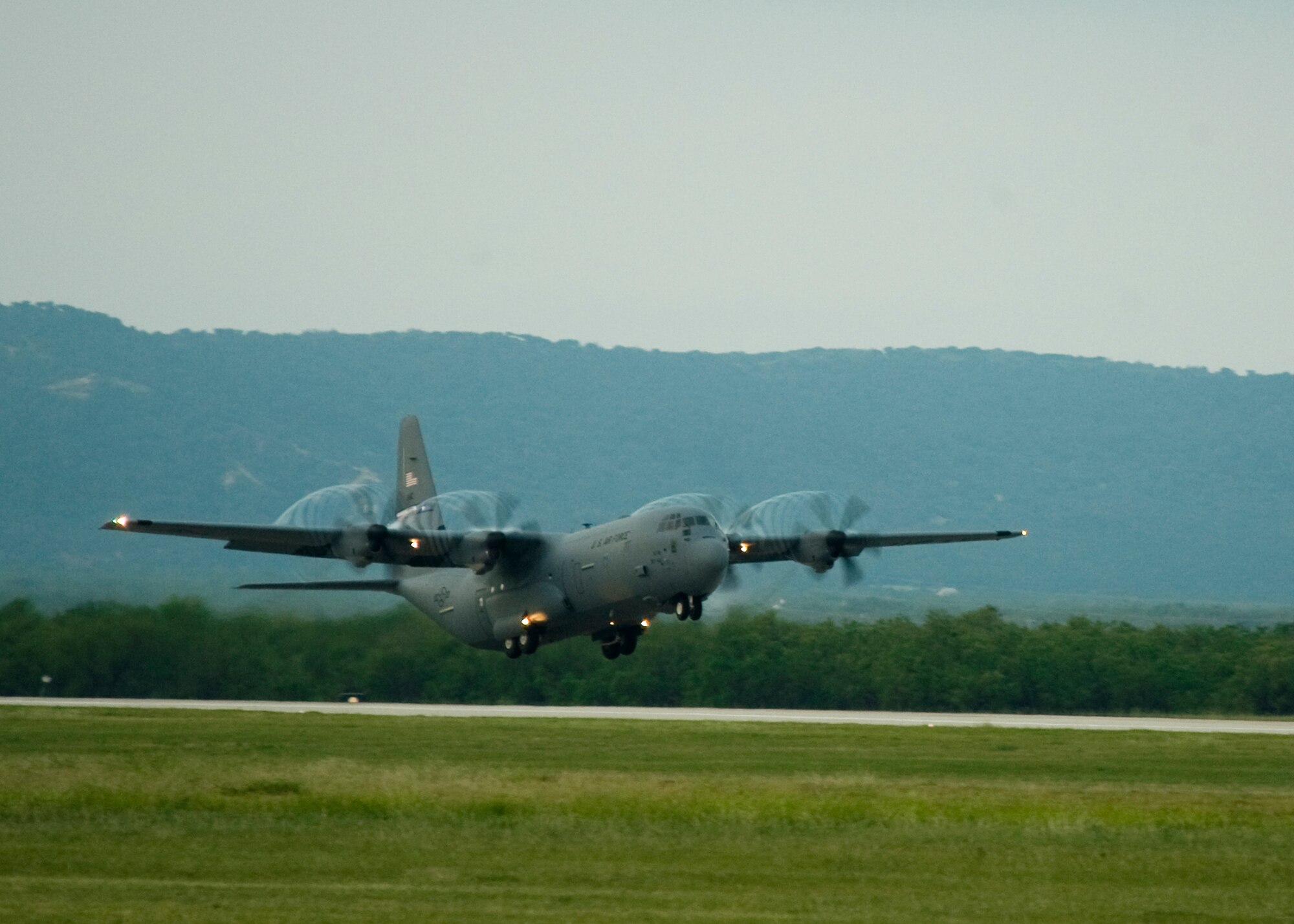 A C-130J takes off Aug. 10, 2013, at Dyess Air Force Base, Texas. The 39th Airlift Squadron was only given a few months notice for their deployment to U.S. Africa Command, however, even with short notice, they were able to gear training towards broadening their focus to single and multiple formations with numerous mission capabilities. (U.S. Air Force photo by Airman 1st Class Peter Thompson/Released)