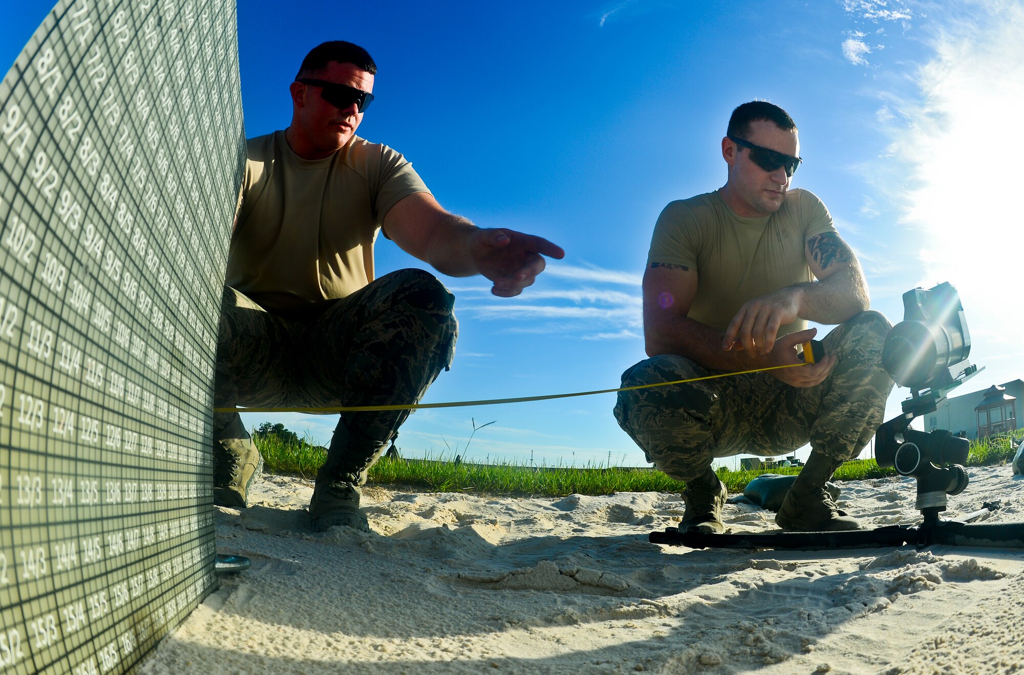 Airman 1st Class Steven Murphy (Left) and Airman 1st Class John Barr IV (Right), explosive ordnance disposal technicians with 6th Civil Engineer Squadron, work together to problem solve a training scenario Aug. 15, 2013, at MacDill Air Force Base, Fla. Barr and Murphy’s training was part of a month-long training on conventional munitions. (U.S. Air Force photo by Staff Sgt. Brandon Shapiro/Released)