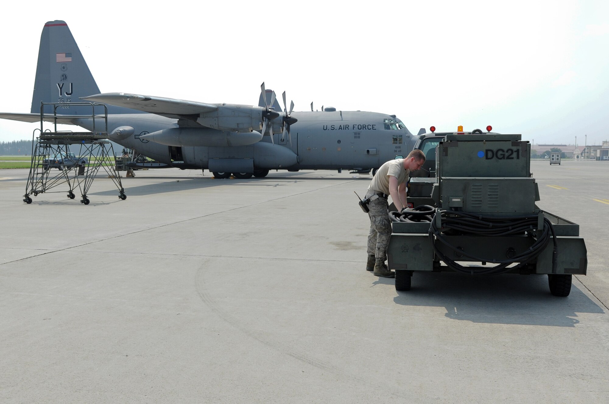 YOKOTA AIR BASE, Japan -- Airman 1st Class Michael Miller, 374th Maintenance Squadron, prepares a generator to be used on a C-130 Hercules Aug. 14, 2013, at Yokota Air Base, Japan. As part of the 374 MXS Aerospace Ground Equipment flight, Miller ensures equipment is delivered to the aircraft in a timely manner. (U.S. Air Force photo by Senior Airman Desiree Economides)