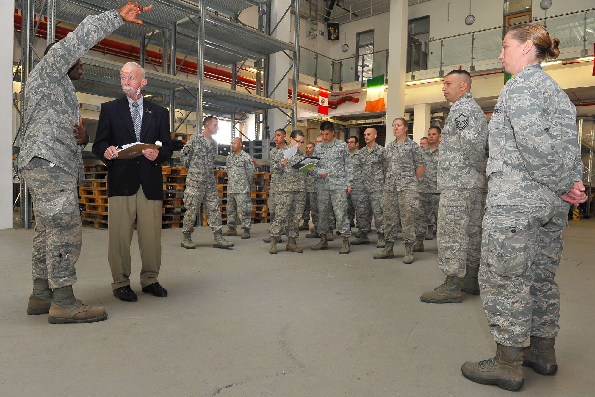 Retired Chief Master Sgt. Gerald Richards, 1st Combat Communication Squadron alumnus, meets with the current Airmen of the 1st CBCS, Aug. 15, 2013, Ramstein Air Base, Germany. (U.S. Air Force photo/Airman Dymekre Allen)