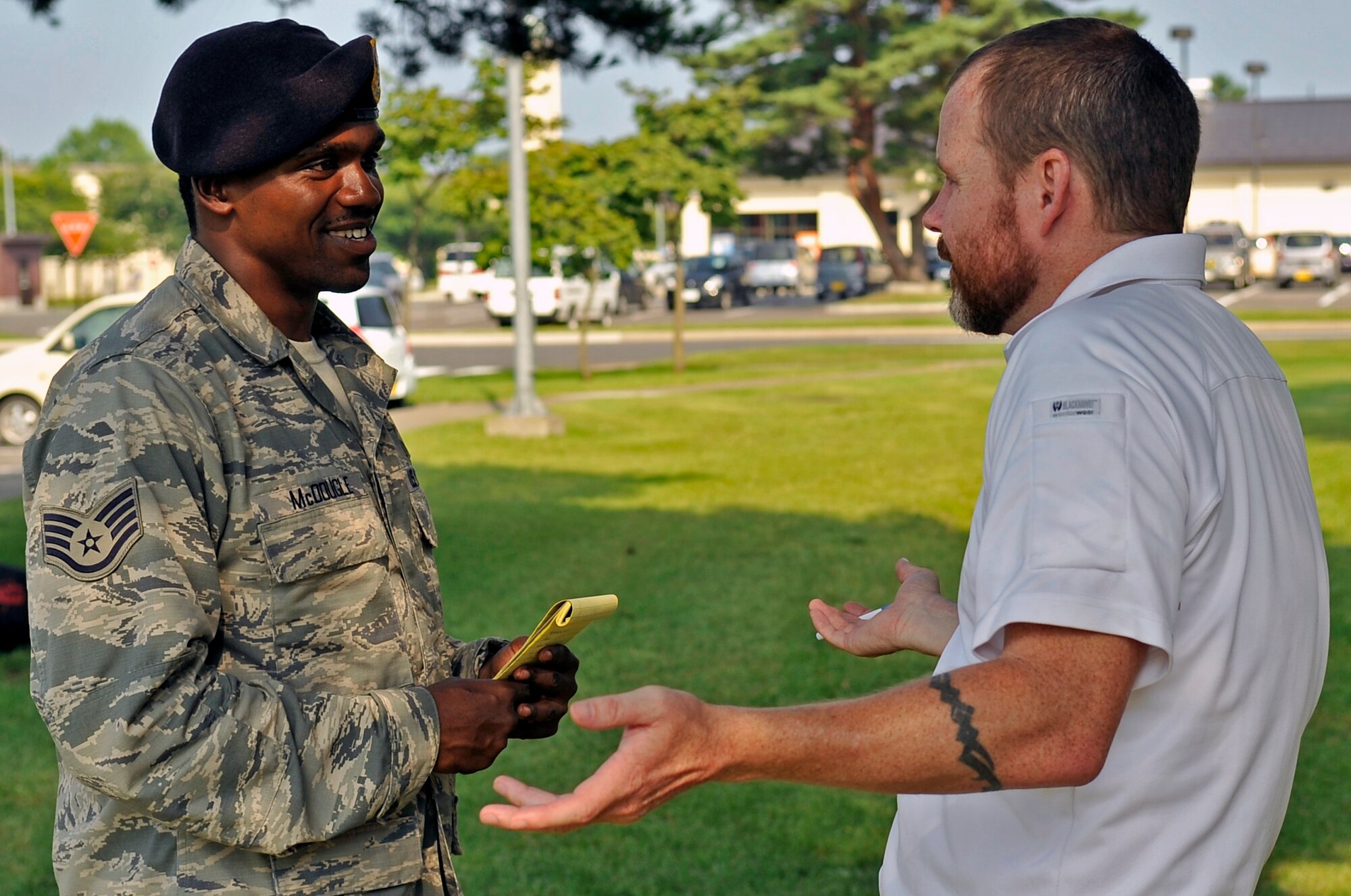 U.S. Air Force Staff Sgt. LaseDerick McDougle, 35th Security Forces Squadron flight chief, goes through a scenario with Jack Anderson, Analytic Services Ink Fly Away Security Team instructor, during FAST training at Misawa Air Base, Japan, Aug. 15, 2013. Anderson is part of a two-man team that taught 35 SFS Airmen the different aspects of FAST training. (U.S. Air Force photo by Airman 1st Class Zachary Kee) 
