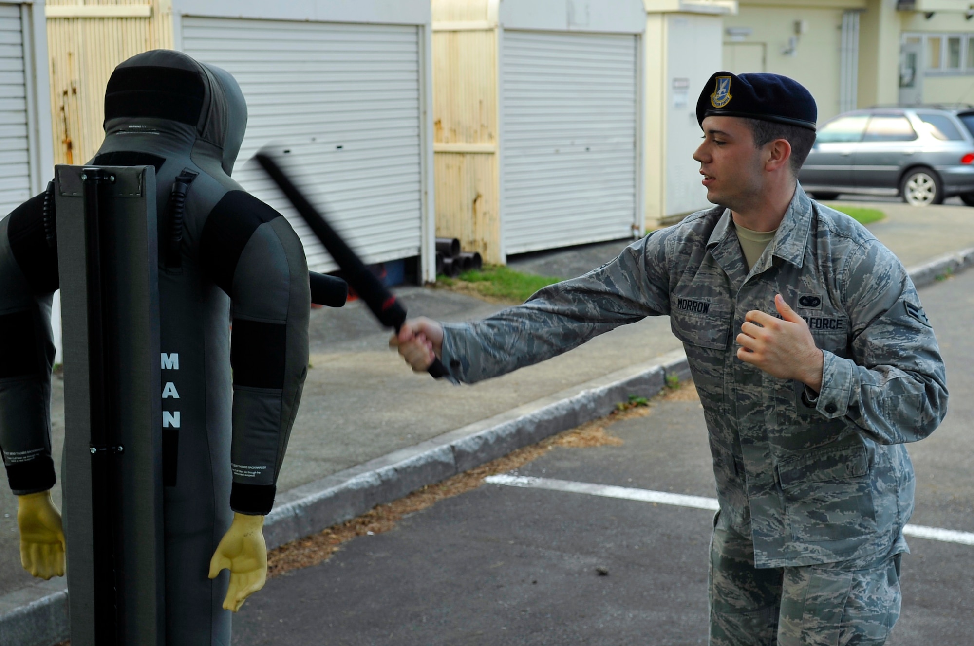 U.S. Air Force Airman 1st Class Simon Morrow, 35th Security Forces Squadron basic force protector, practices striking with a training baton on a dummy during Fly Away Security Team training at Misawa Air Base, Japan, Aug. 15, 2013. FAST training is important because it teaches 35 SFS members how to post security and keep aircraft safe on an unsecured airfield. (U.S. Air Force photo by Airman 1st Class Zachary Kee)