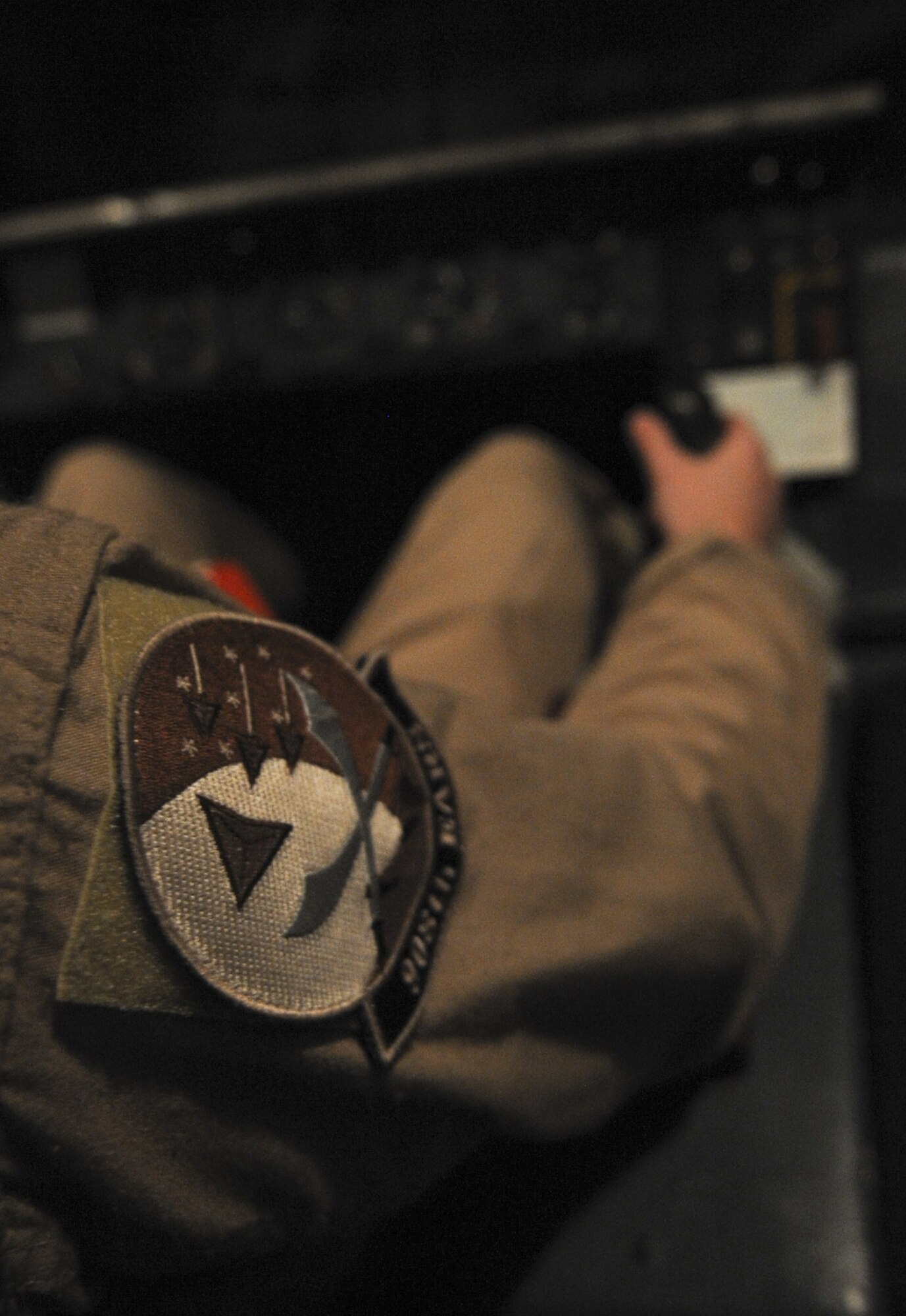 The patch of the 908th Expeditionary Air Refueling Squadron worn by U.S. Air Force Senior Airman Turner Foote, a boom operator, while he prepares the refueling boom for an E-3 Sentry at an undisclosed location in Southwest Asia Aug. 10, 2013. The refueling boom and hose and center-line drogue system of the KC-10 Extender are used to aerial refuel U.S. and allied aircraft. Foote calls Jackson, Miss., home and is deployed from Joint Base McGuire-Dix-Lakehurst, N.J. (U.S. Air Force photo by Staff Sgt. Jacob Morgan)