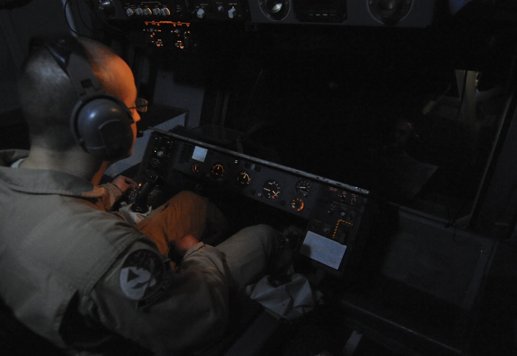U.S. Air Force Senior Airman Turner Foote, 908th Expeditionary Air Refueling Squadron boom operator, prepares a refueling boom to refuel an E-3 Sentry at an undisclosed location in Southwest Asia Aug. 10, 2013. The refueling boom and hose and center-line drogue system of the KC-10 Extender are used to aerial refuel U.S. and allied aircraft. Foote calls Jackson, Miss., home and is deployed from Joint Base McGuire-Dix-Lakehurst, N.J. (U.S. Air Force photo by Staff Sgt. Jacob Morgan)