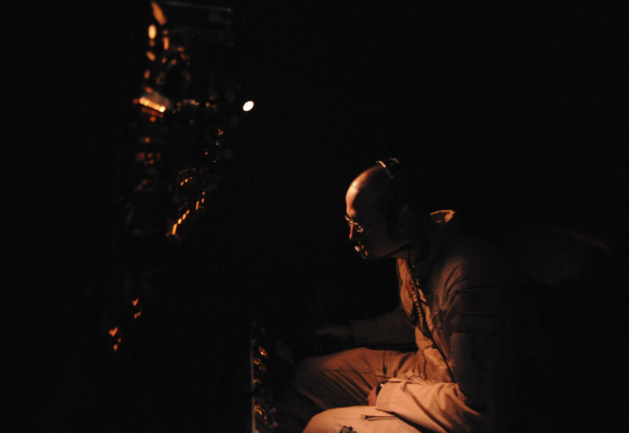 U.S. Air Force Senior Airman Turner Foote, 908th Expeditionary Air Refueling Squadron boom operator, performs an operations check on the refueling boom of a KC-10 Extender at an undisclosed location in Southwest Asia Aug. 10, 2013. The refueling boom and hose and center-line drogue system of the KC-10 Extender are used to aerial refuel U.S. and allied aircraft. Foote calls Jackson, Miss., home and is deployed from Joint Base McGuire-Dix-Lakehurst, N.J. (U.S. Air Force photo by Staff Sgt. Jacob Morgan)